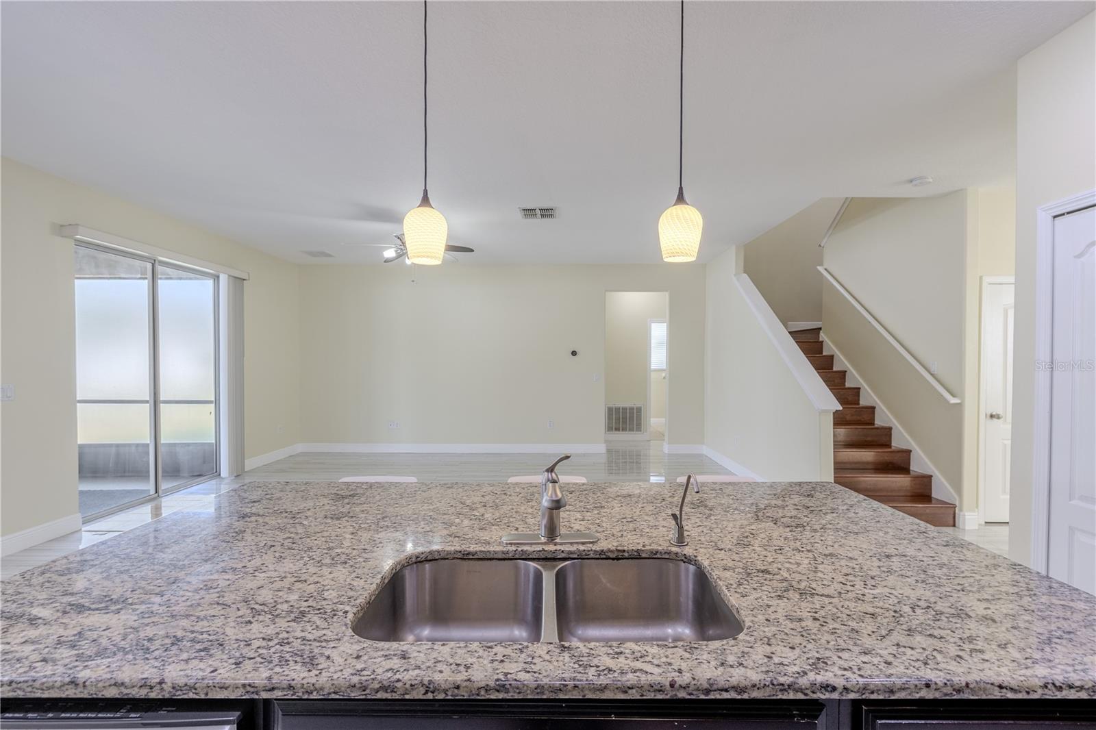 View into the family room from the kitchen island.