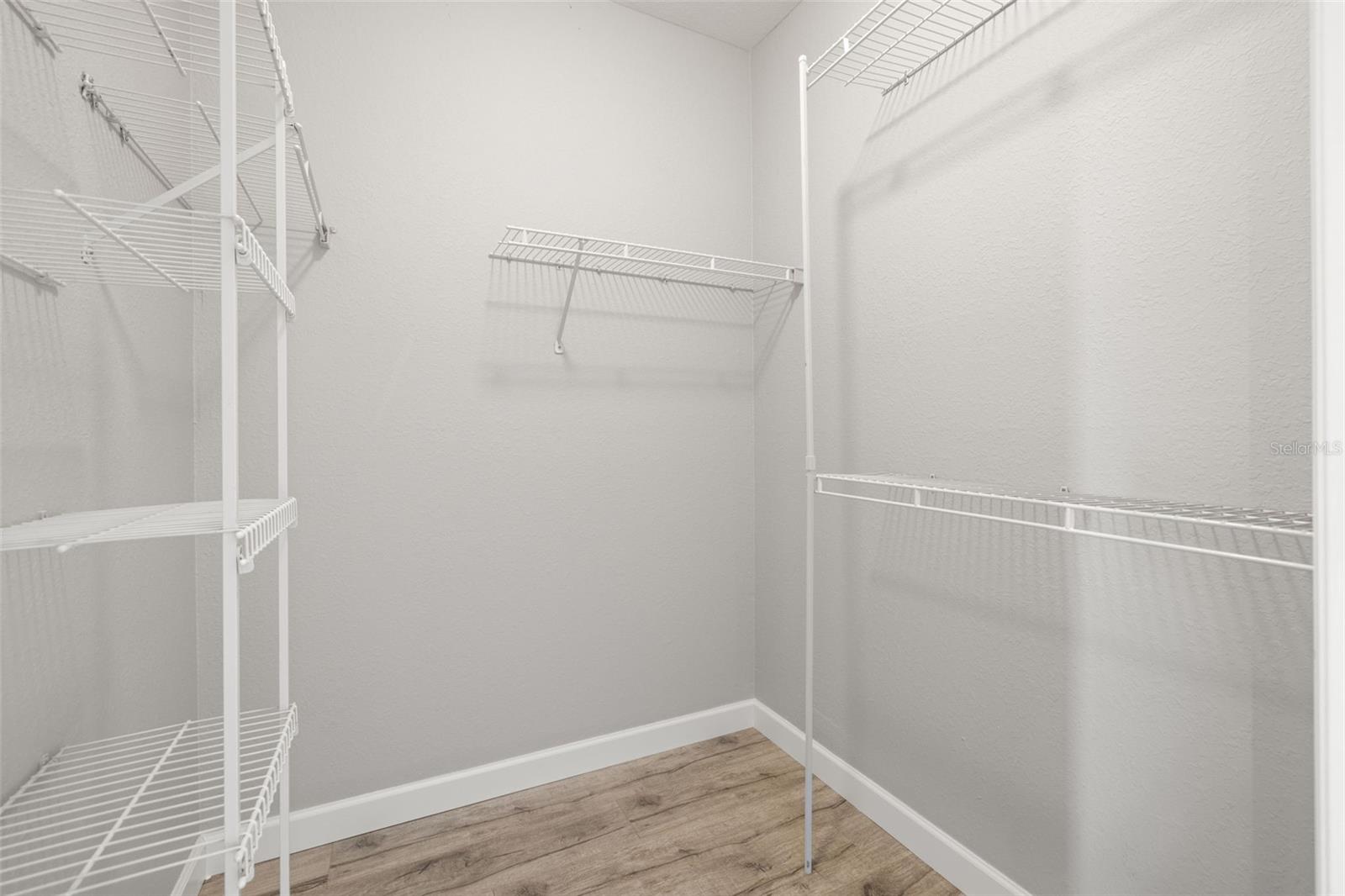 PRIMARY BEDROOM WALK-IN CLOSET