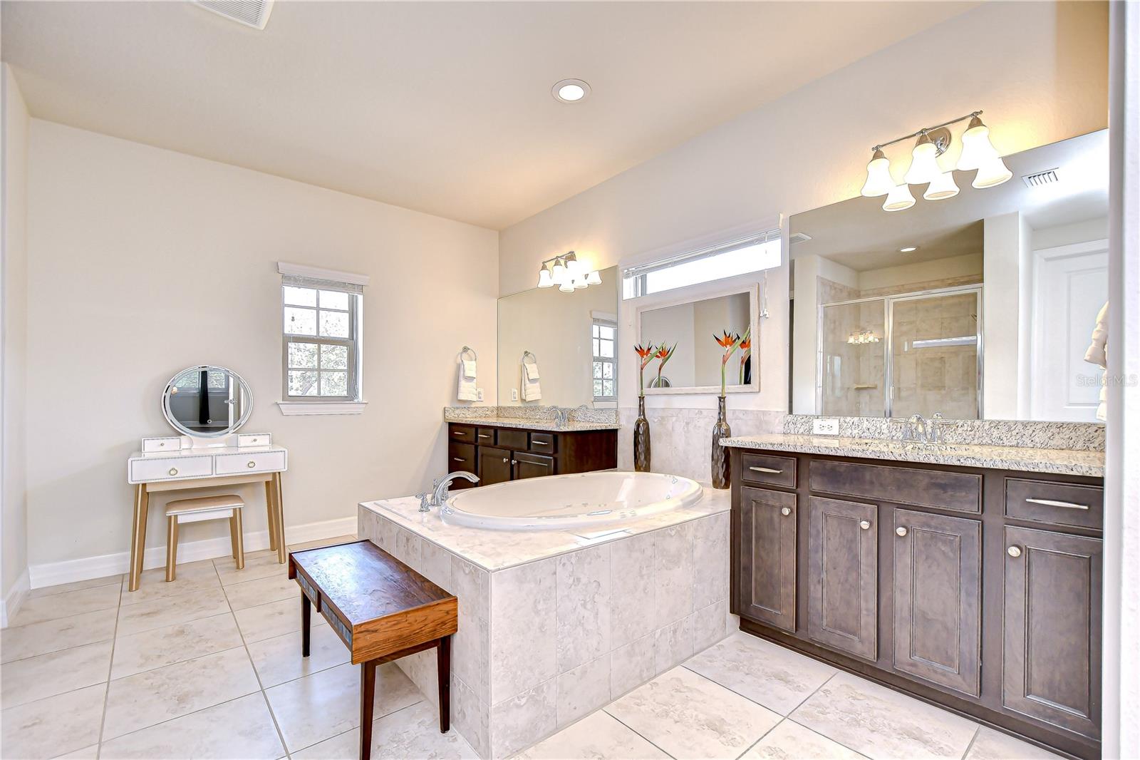 Featuring seperate vanities, soaking tub, and separate walk-in shower!
