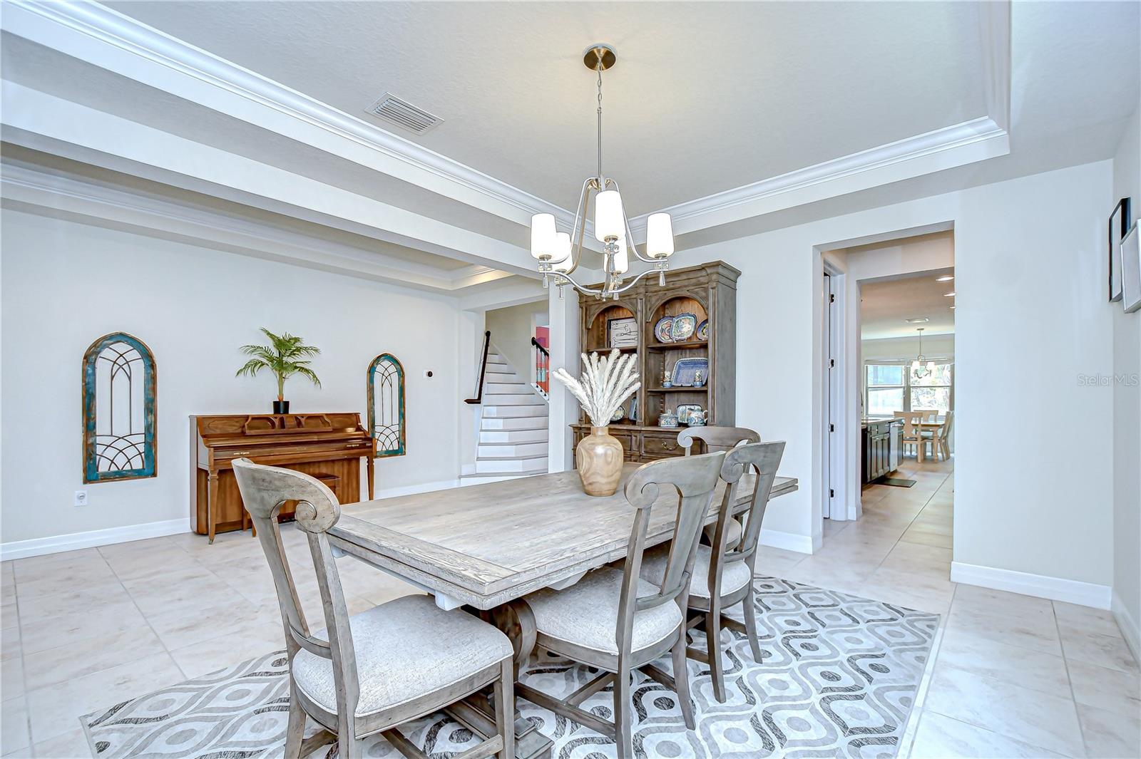 There is a butlers pantry and huge walk-in pantry connecting the dining room to the kitchen!