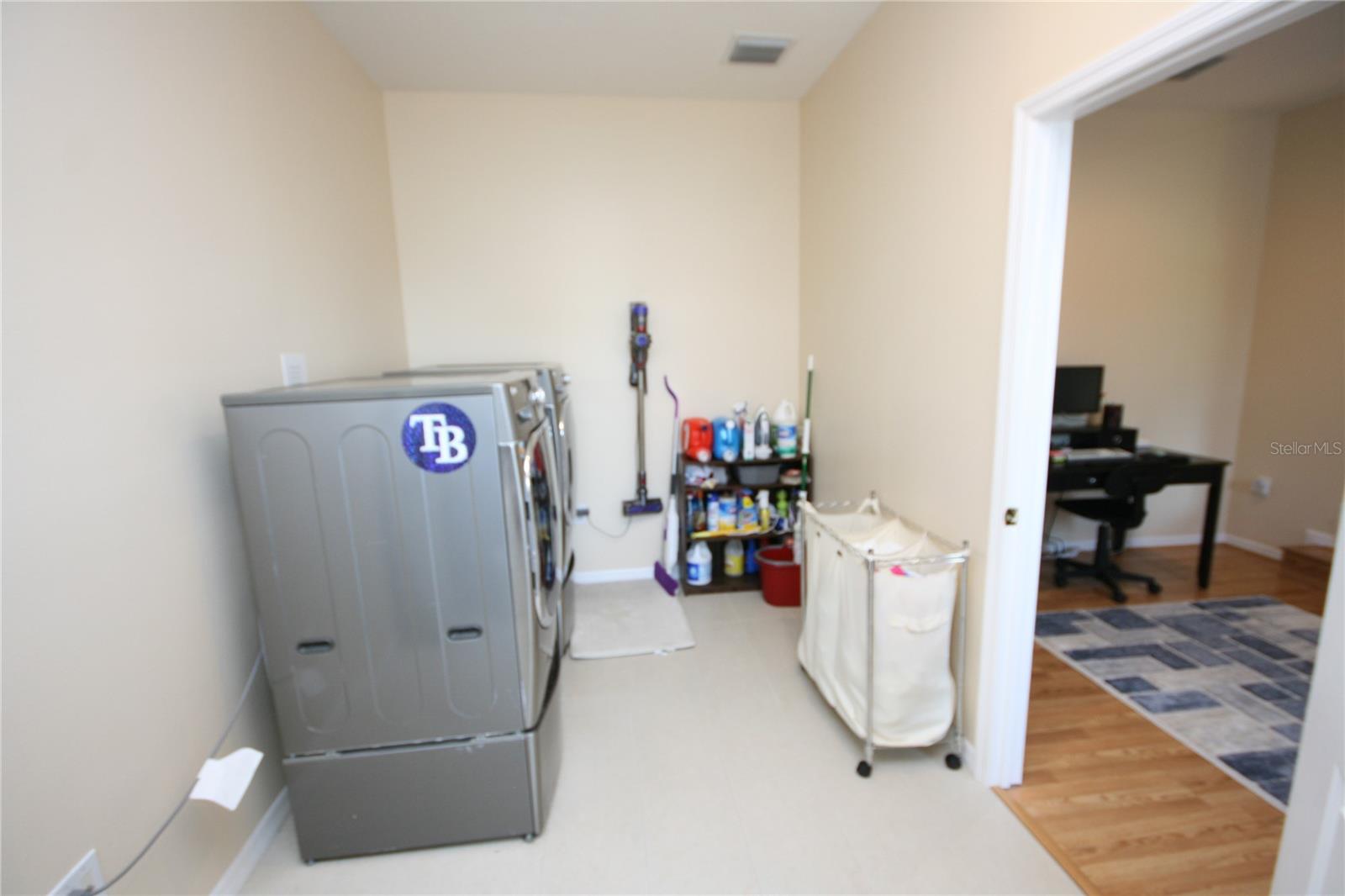 Extra large and extra long 2nd laundry room upstairs.  With an extra 4-5 feet behind camera!