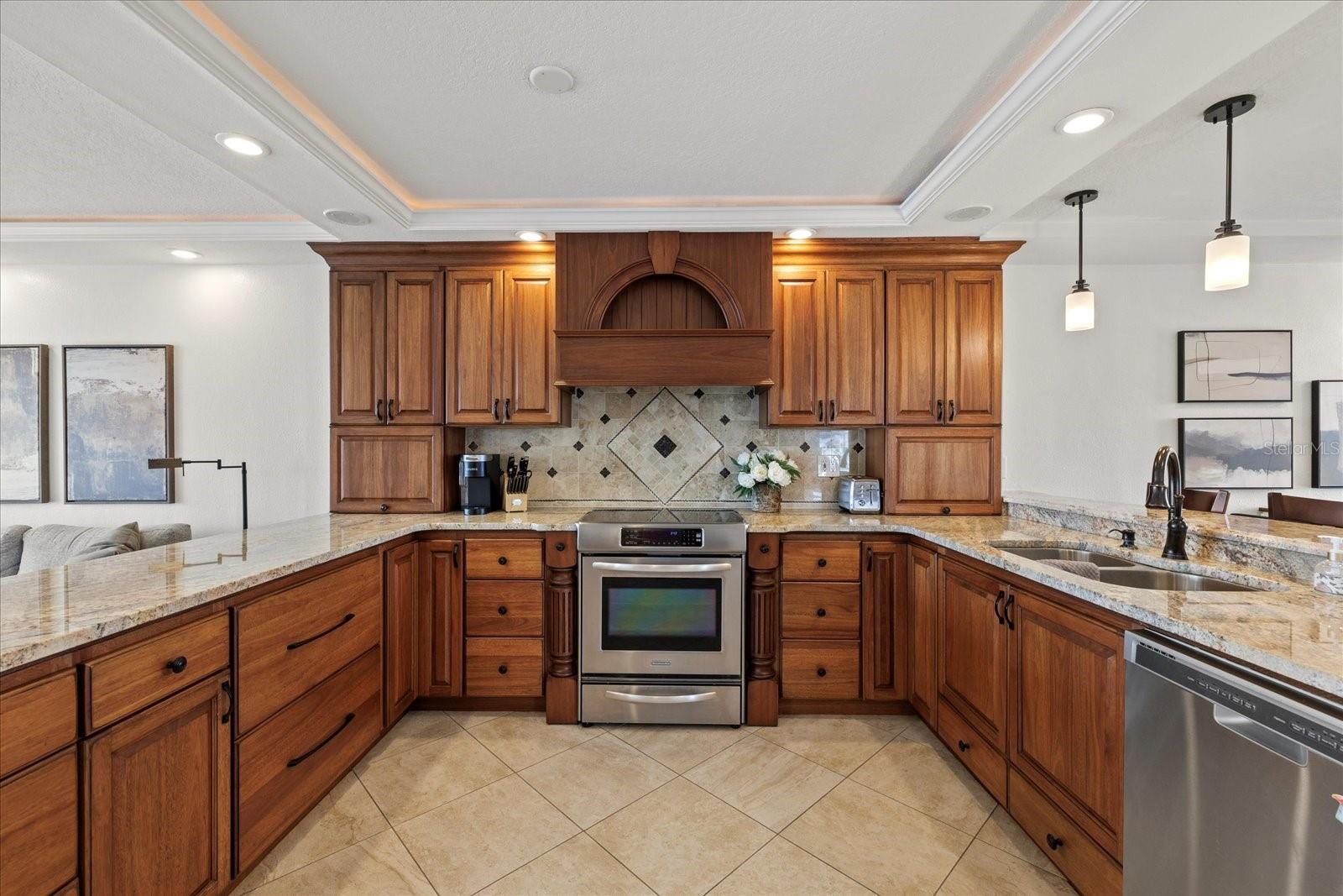 Walnut cabinets, granite counters and stainless appliances