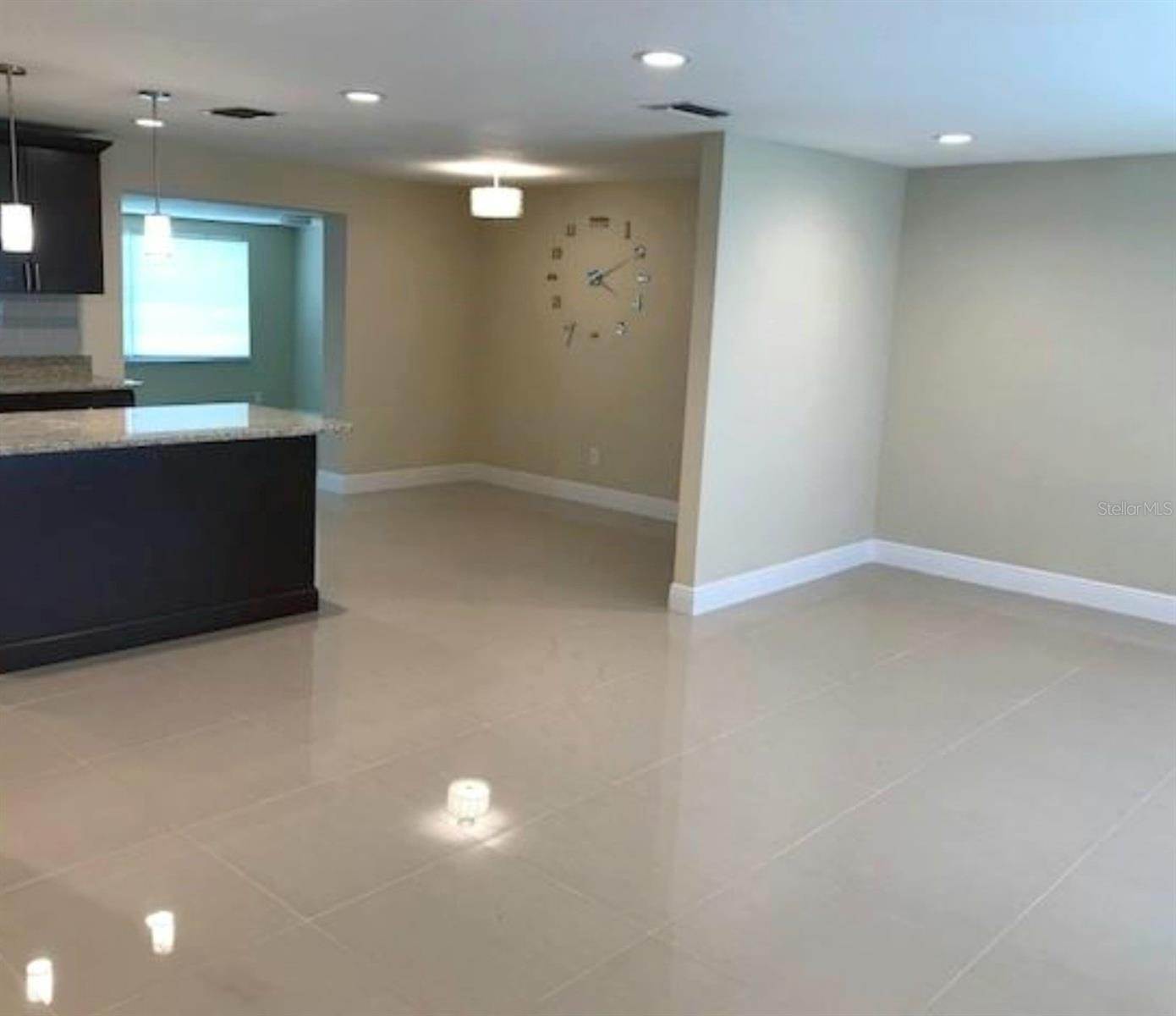 Large dining room leading to kitchen