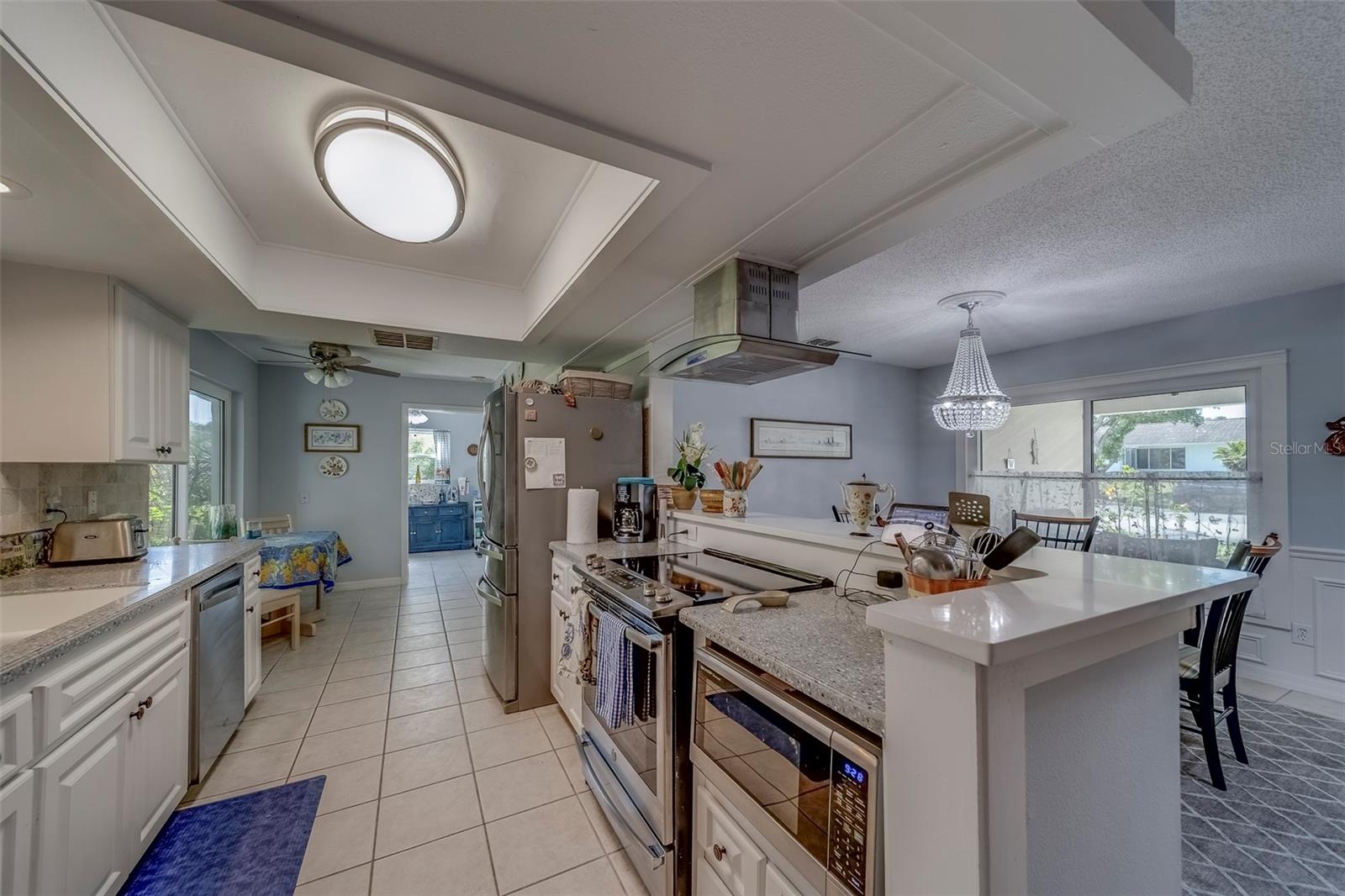 Kitchen looking toward eat in area and laundry room.