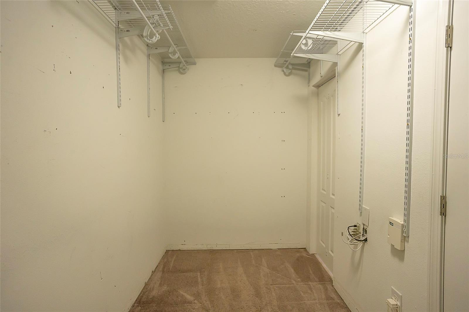 Primary bedroom walk-in closet