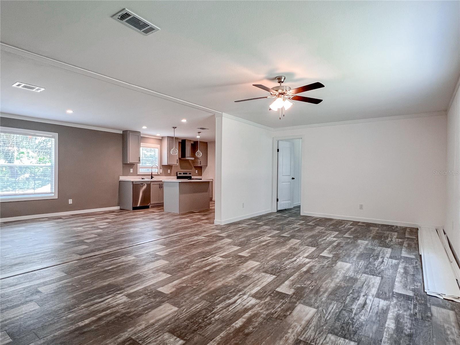 Open concept living room leading to huge dining room.