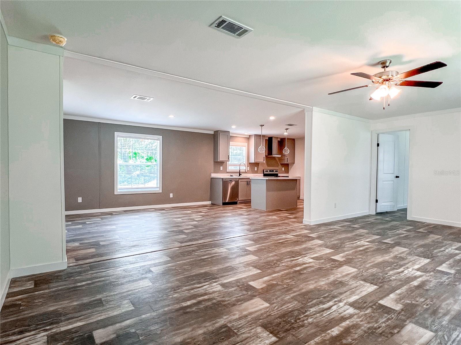Open concept living room leading to huge dining room.
