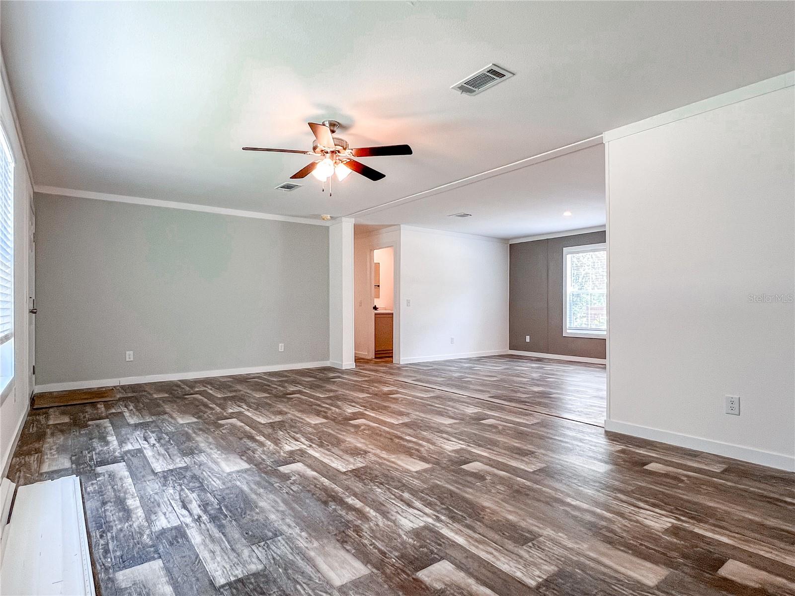 Open concept living room leading to huge dining room.