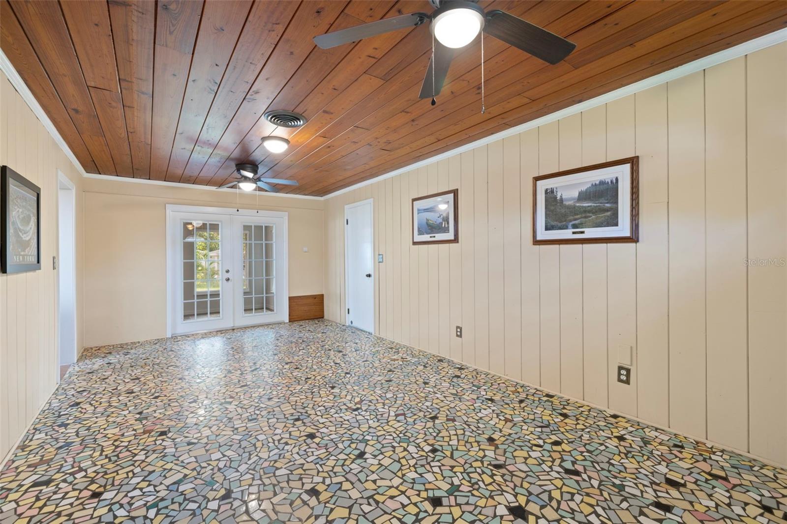 Large Bonus Room with classic vintage Florida Breezeway Terrazzo Flooring and wood paneling!!