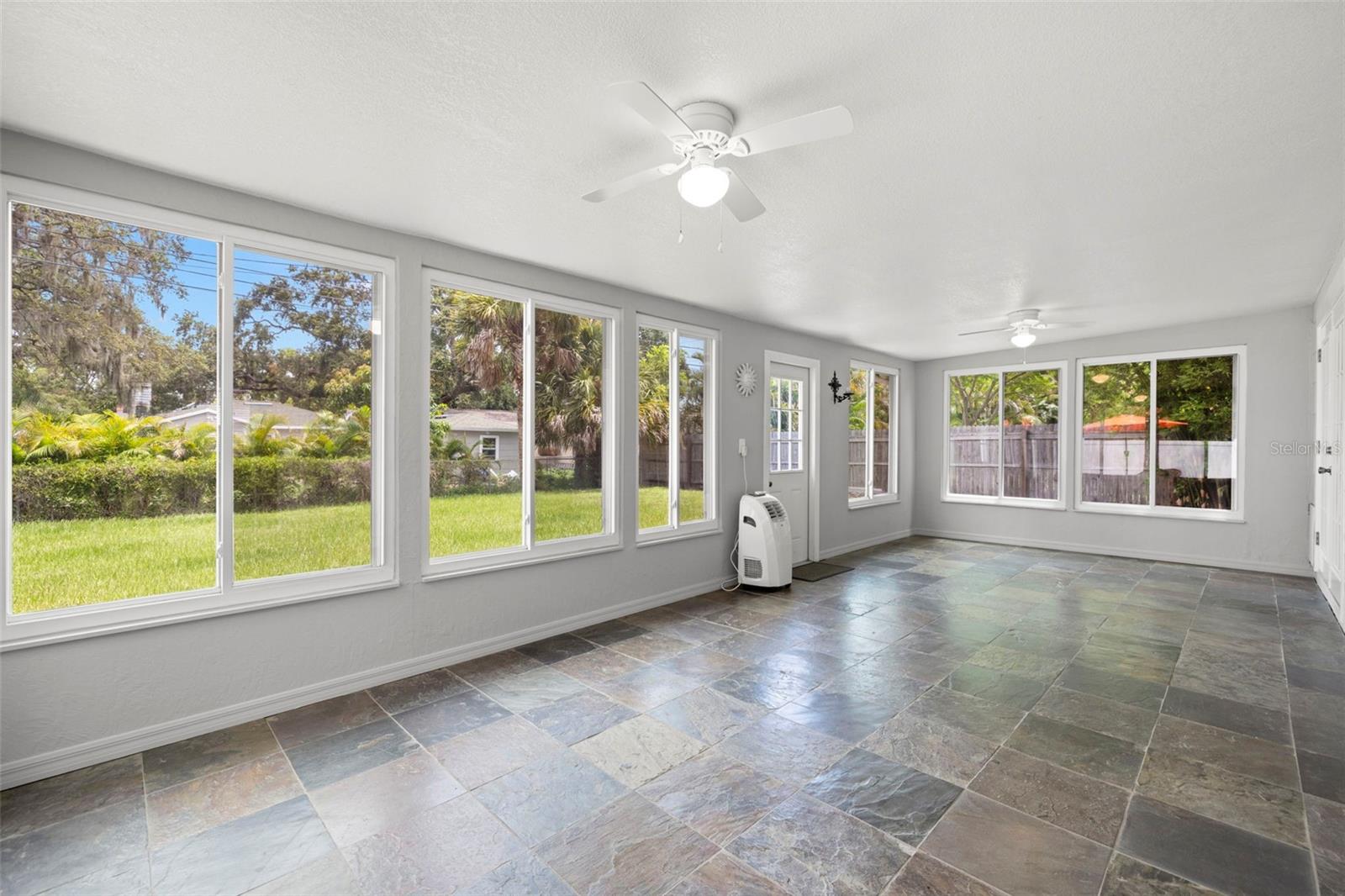 Fantastic Bonus Room/Florida Room leading out to the spacious backyard