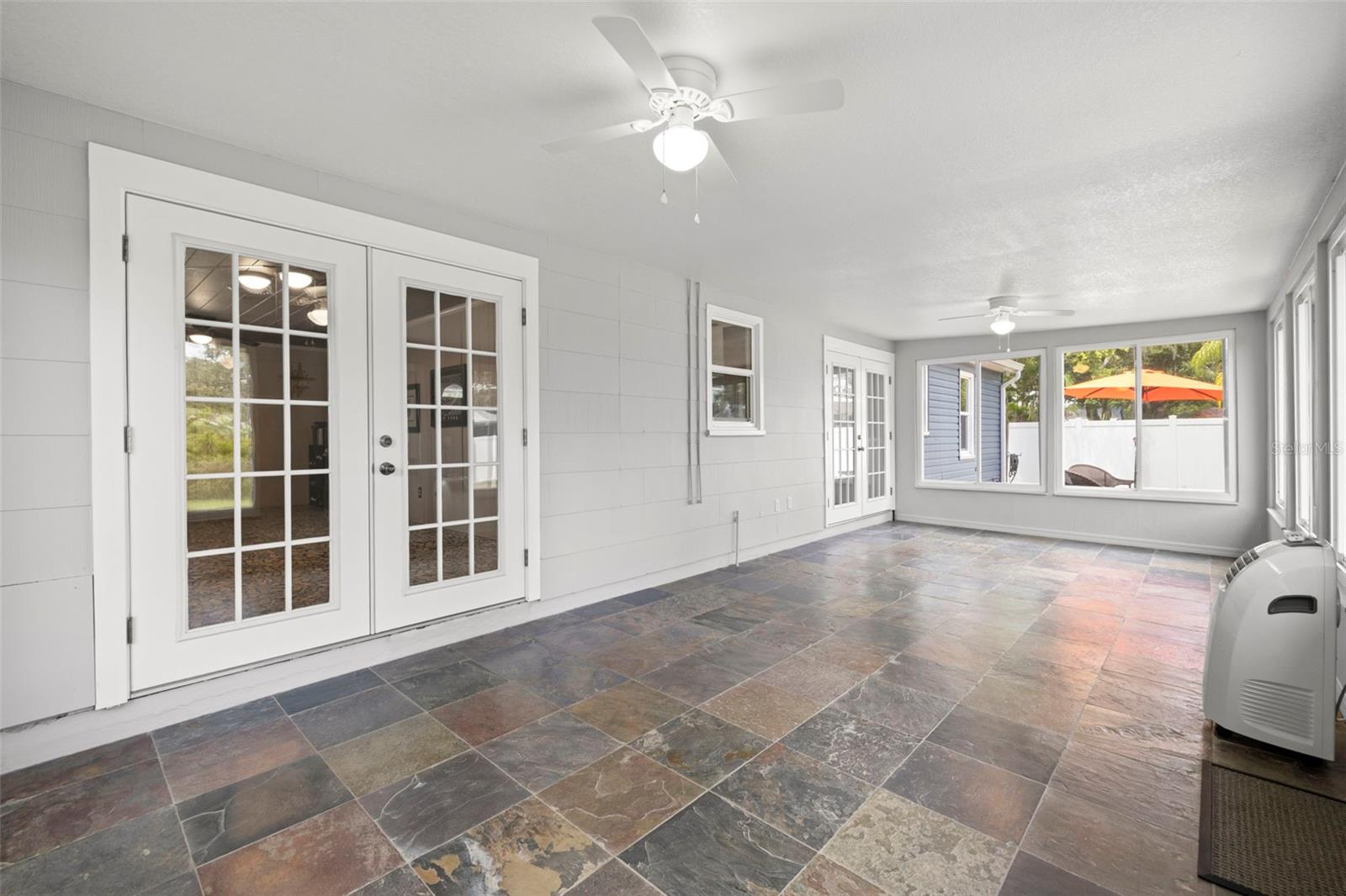 Fantastic Bonus Room/Florida Room leading out to the spacious backyard