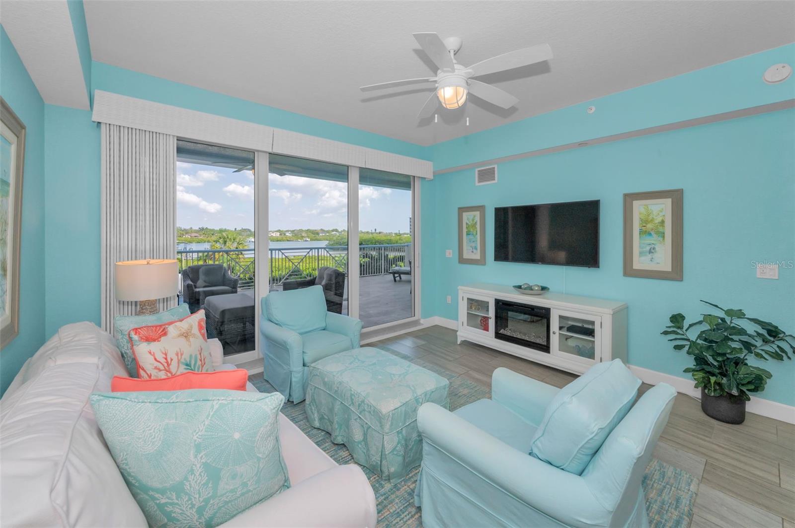 Living Room with Views of the Water through the Sliding Glass Door an onto the balcony