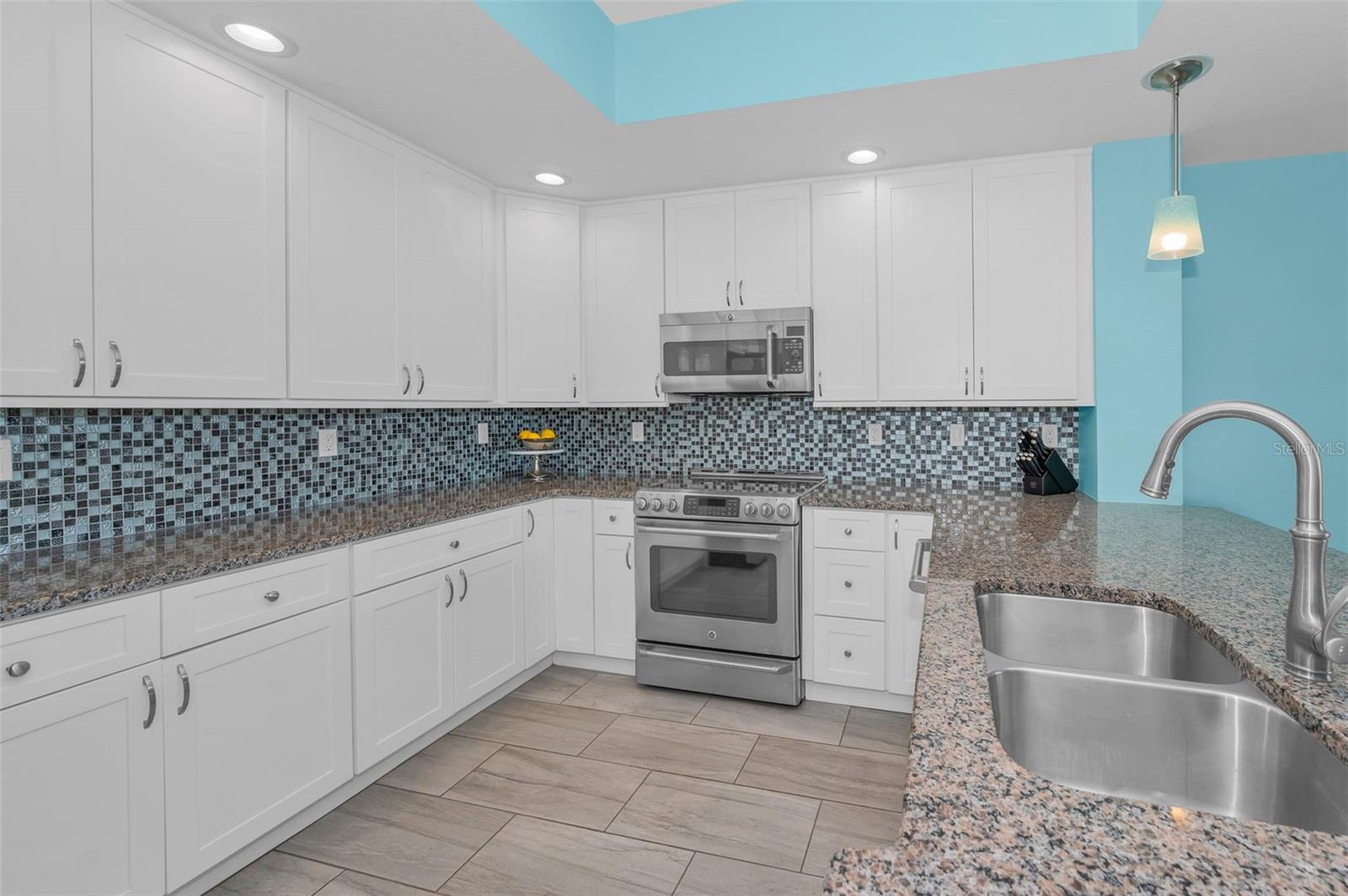Wonderful Shaker cabinets, tile backsplash, Quartz countertops & more!