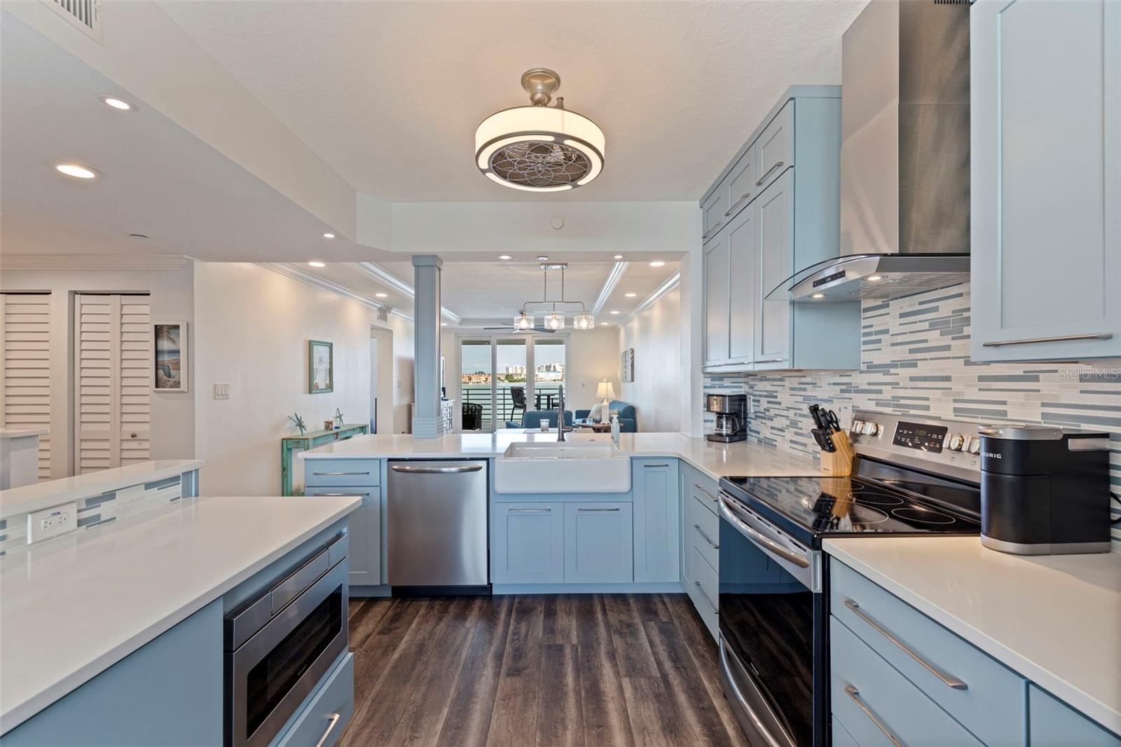 Porcelain Farm Sink and Custom Quartz Countertops.