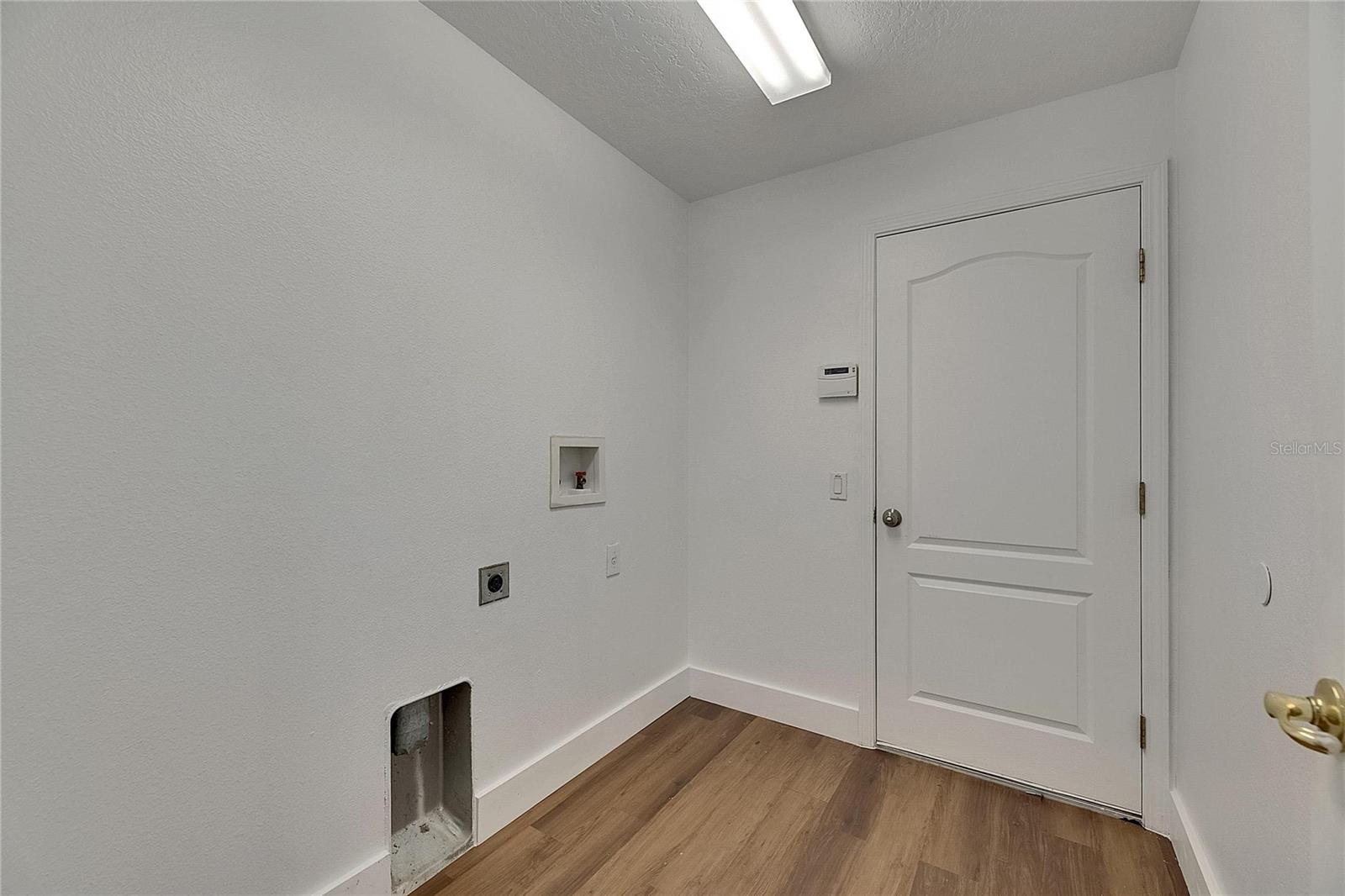 Laundry Room that leads to the garage