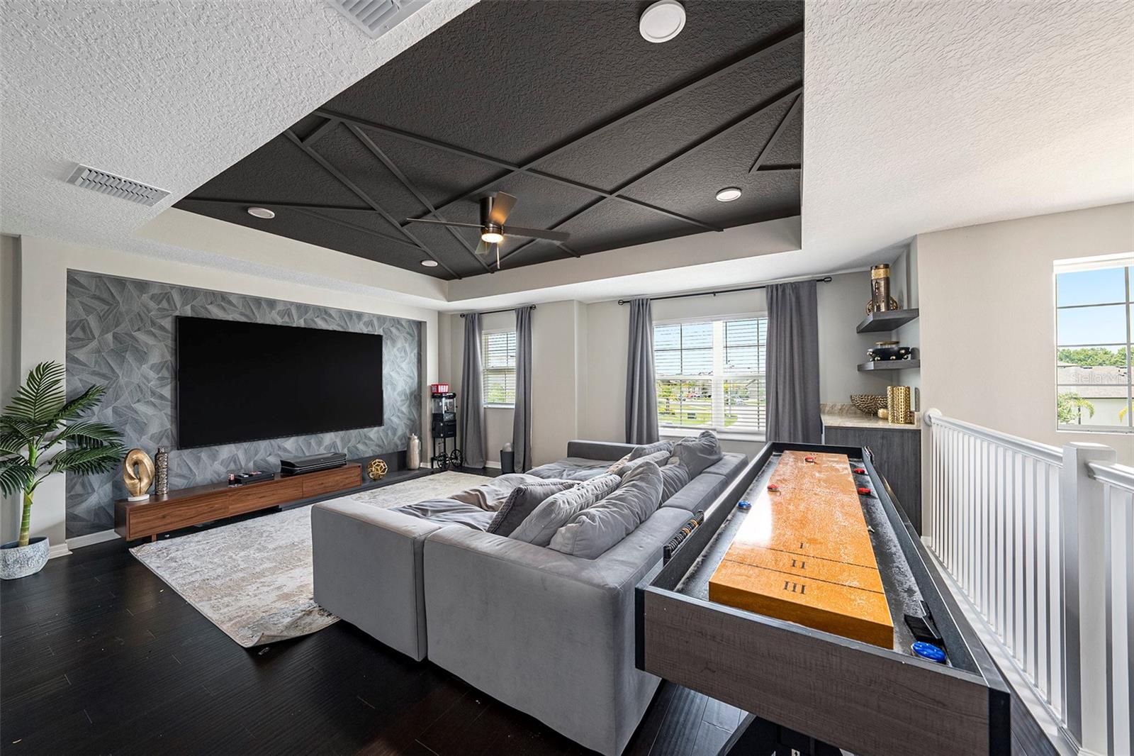 Family theater/lounging area - professionally designed accent wall