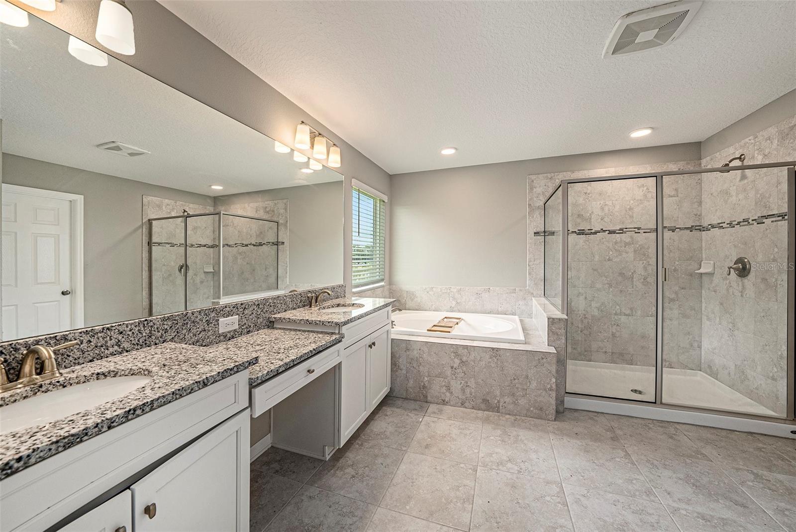 Primary bath with soaking tub and standup shower
