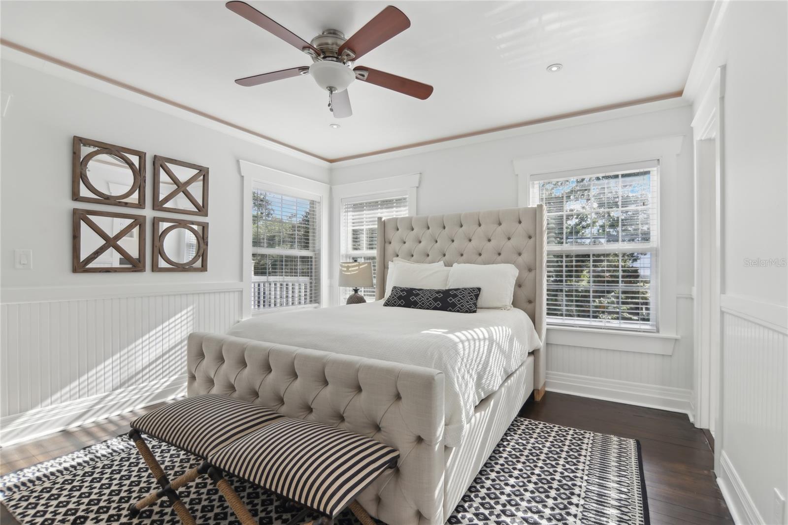 Each of the four upstairs bedrooms includes an en-suite bath and access to a private balcony.