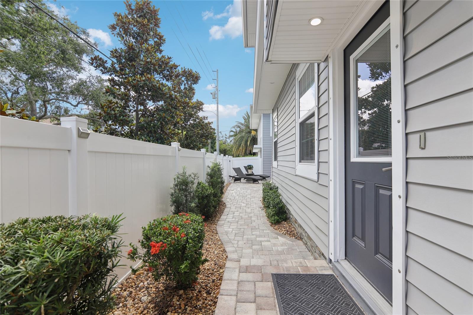 The pool is accessible from the side of the home.