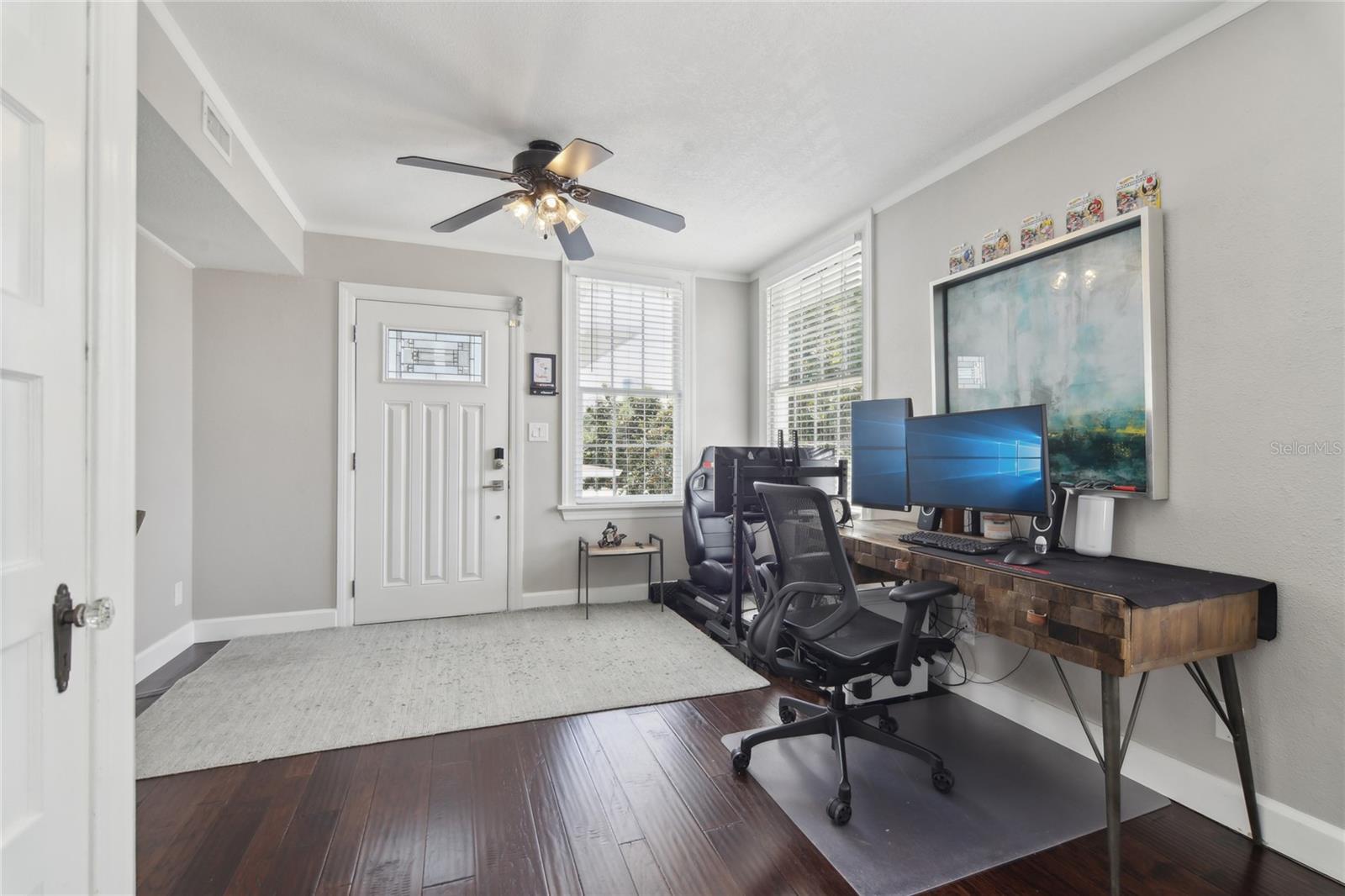 The ADU is a 1-bedroom, 1-bathroom unit with a living room. This image shows the flex space currently used as an office.