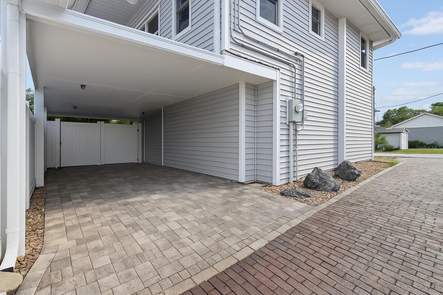 Large carport in the back of the home that can be used for rental parking or guest parking.