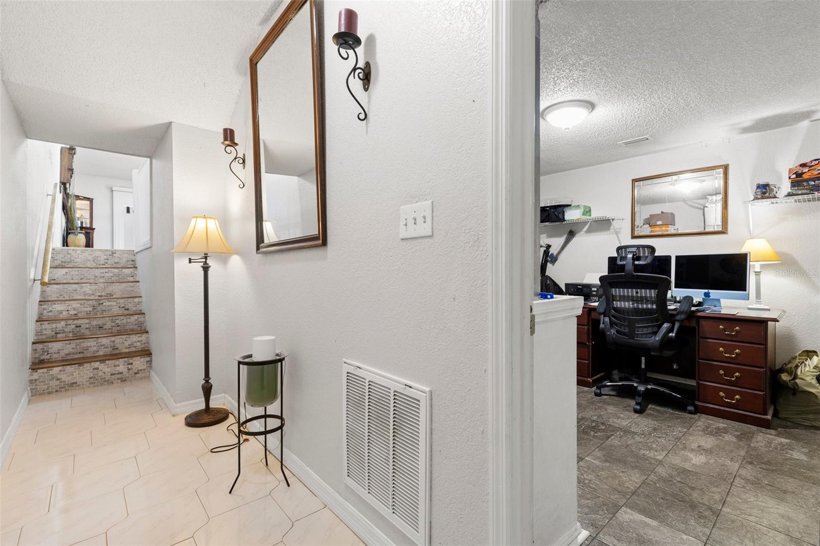 Foyer with laundry and utility room off of the garage