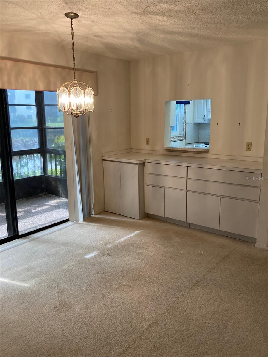 Dining room has slider to screened porch
