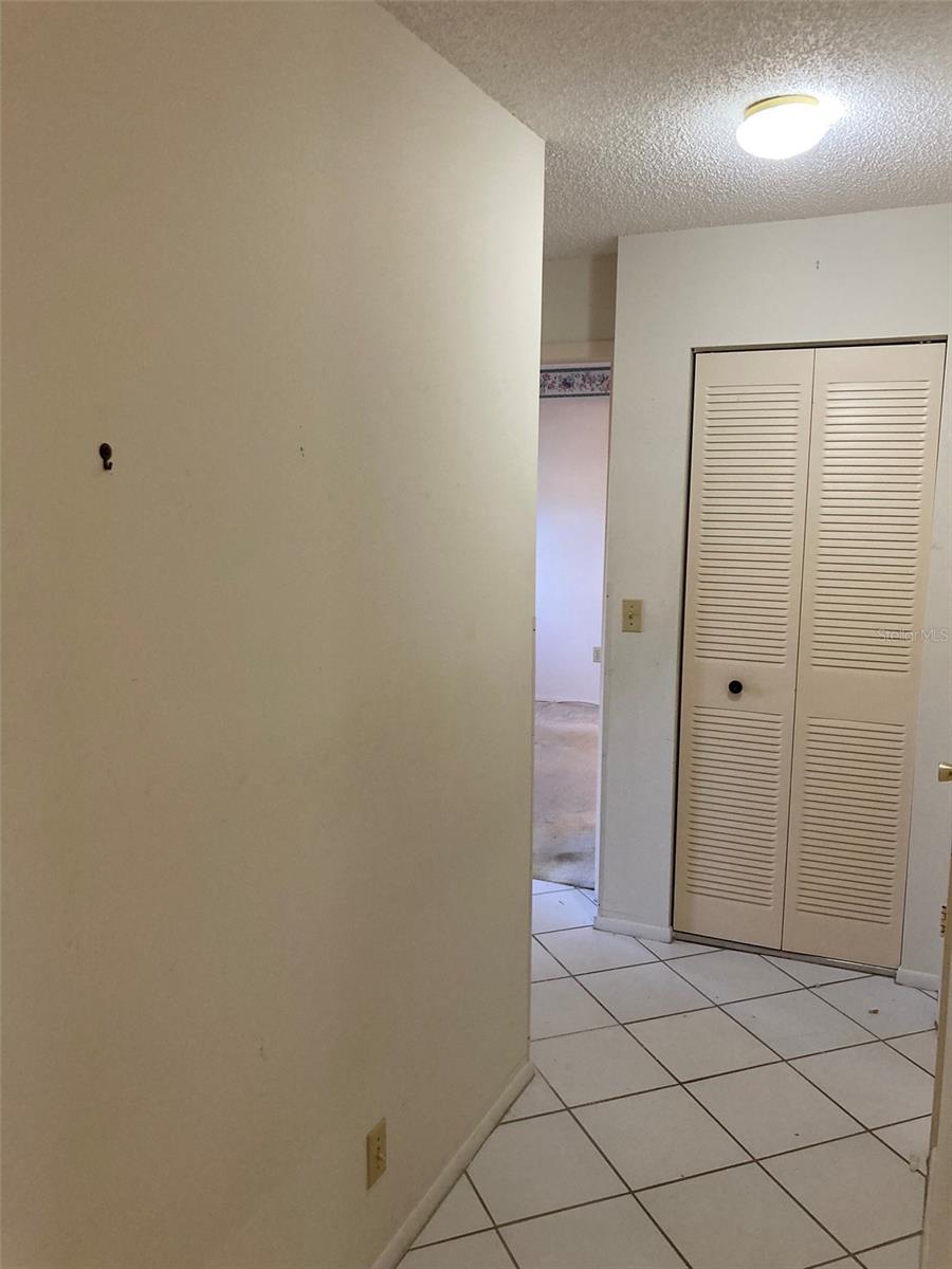 Hallway to both bedrooms and baths