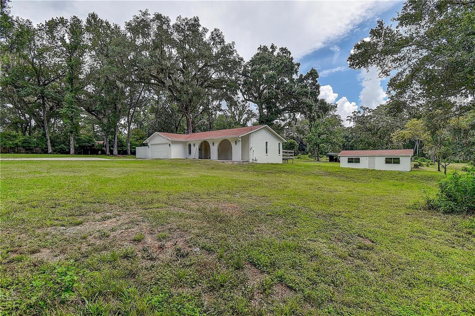 5 acres with House on left and Office/Kennel on right