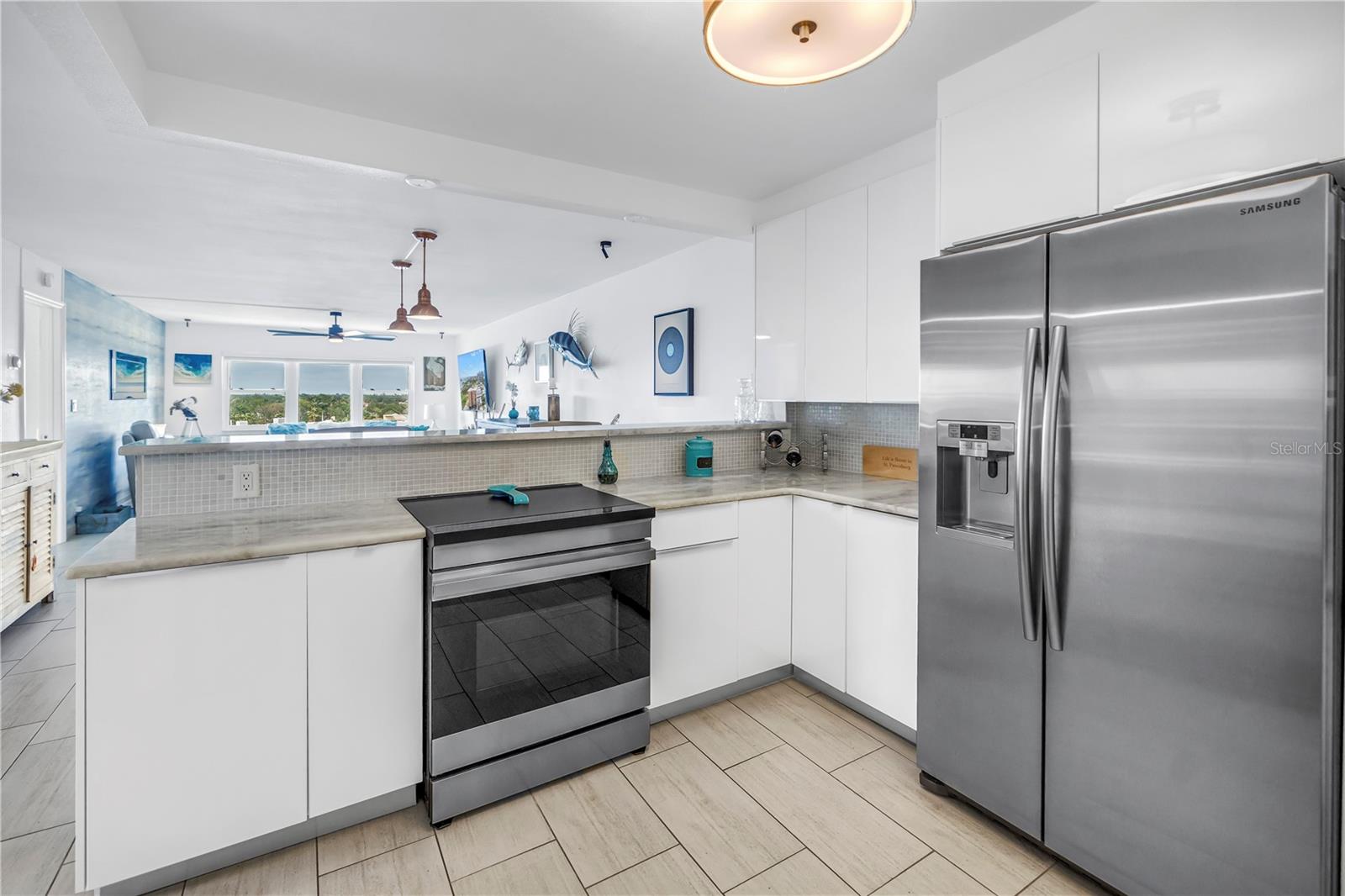 Stainless steel appliances and stone countertops.
