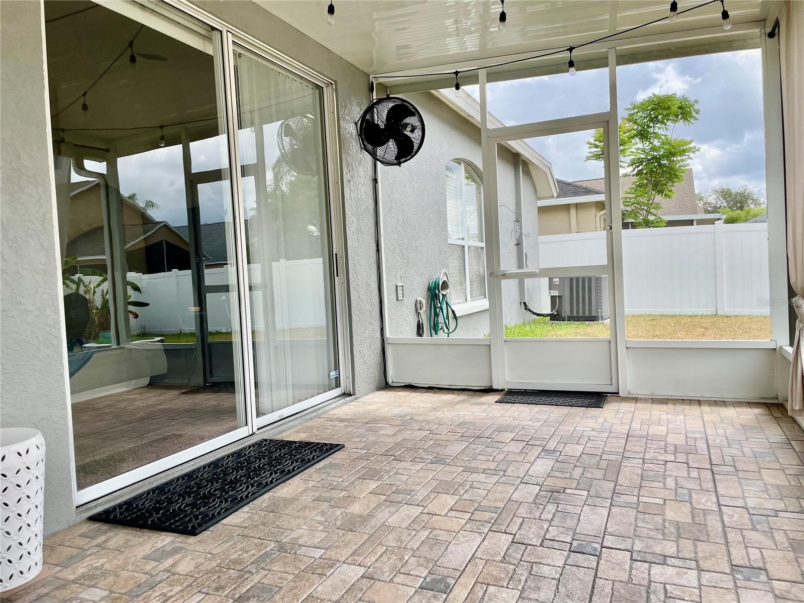 Paver tiled extended screened in covered