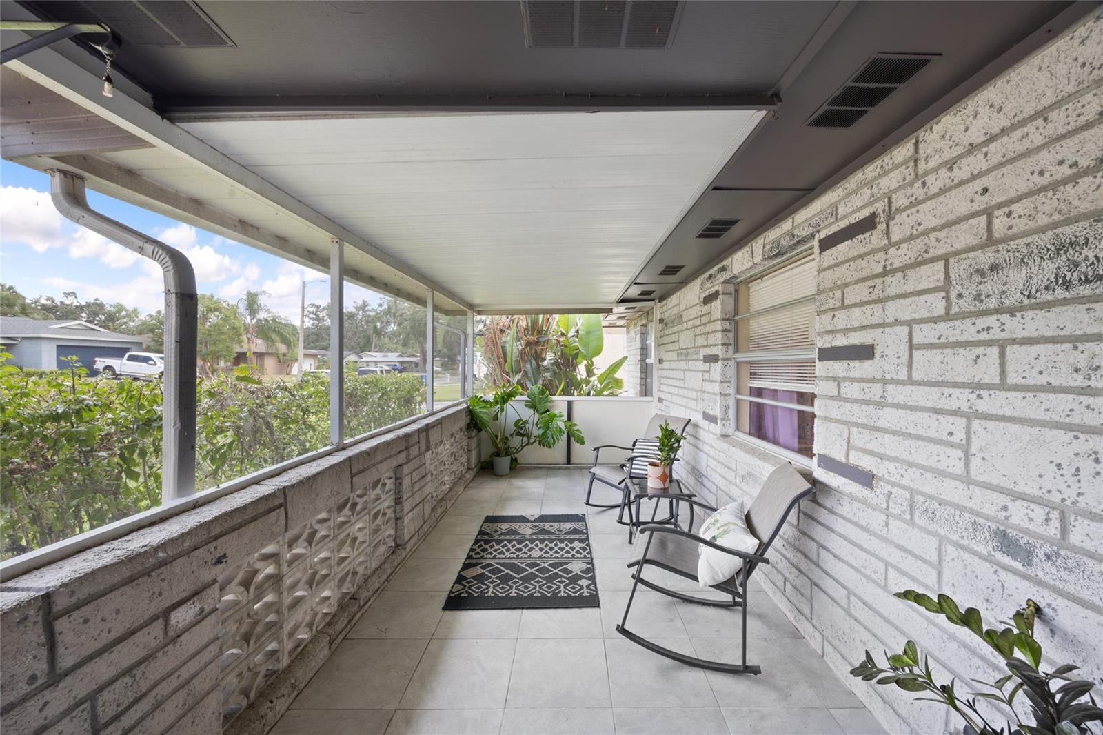 The porch half wall has a mid-century modern vibe