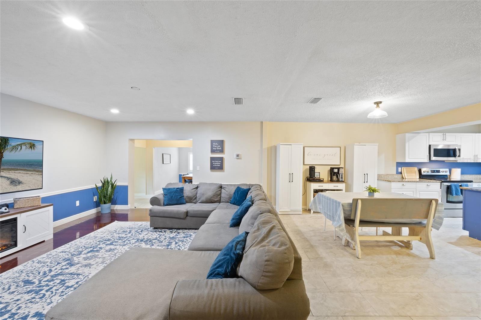 Family Room with recessed lighting, laminate flooring, fresh paint and open concept