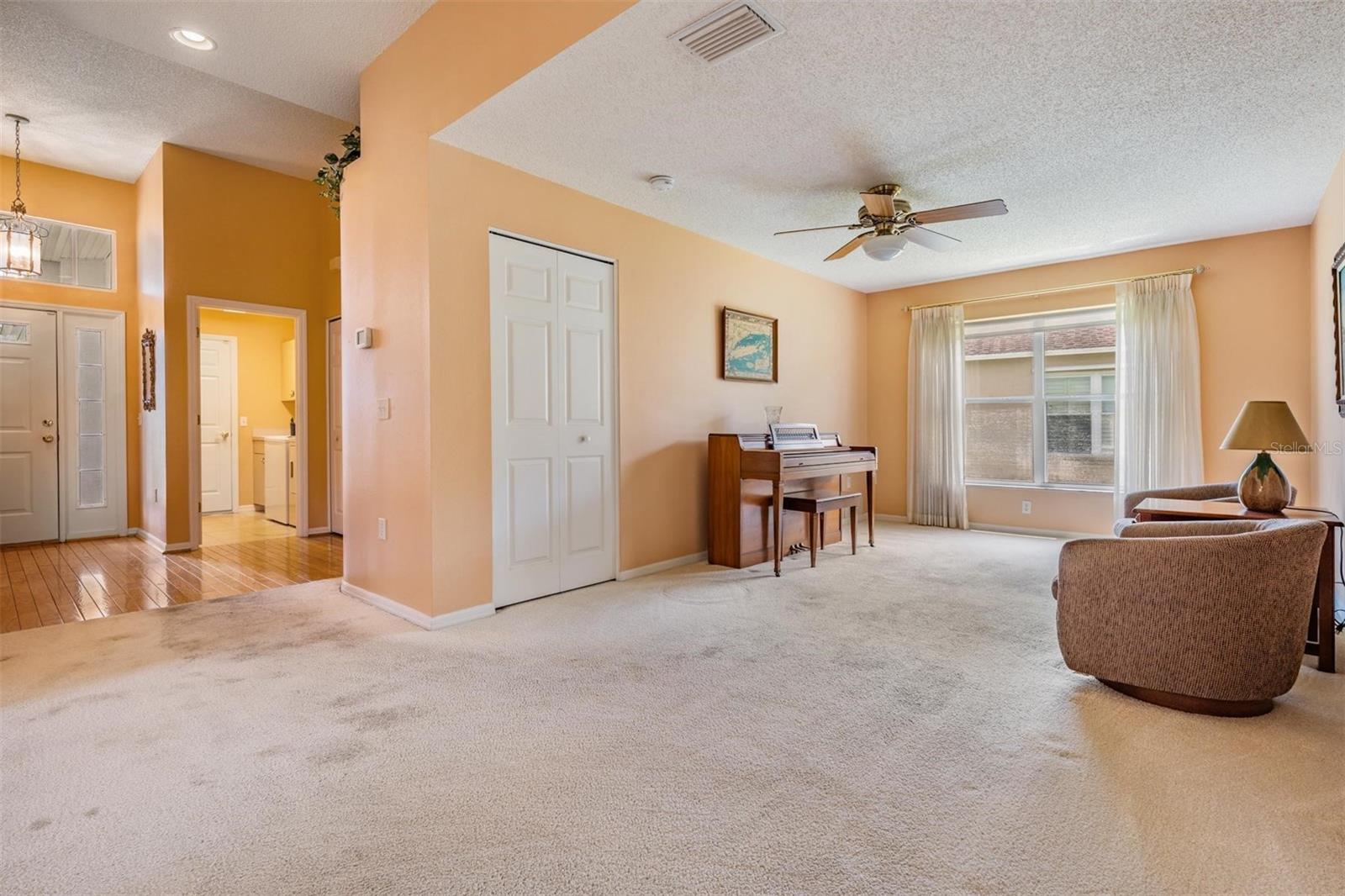 View of foyer, laundry and flex space