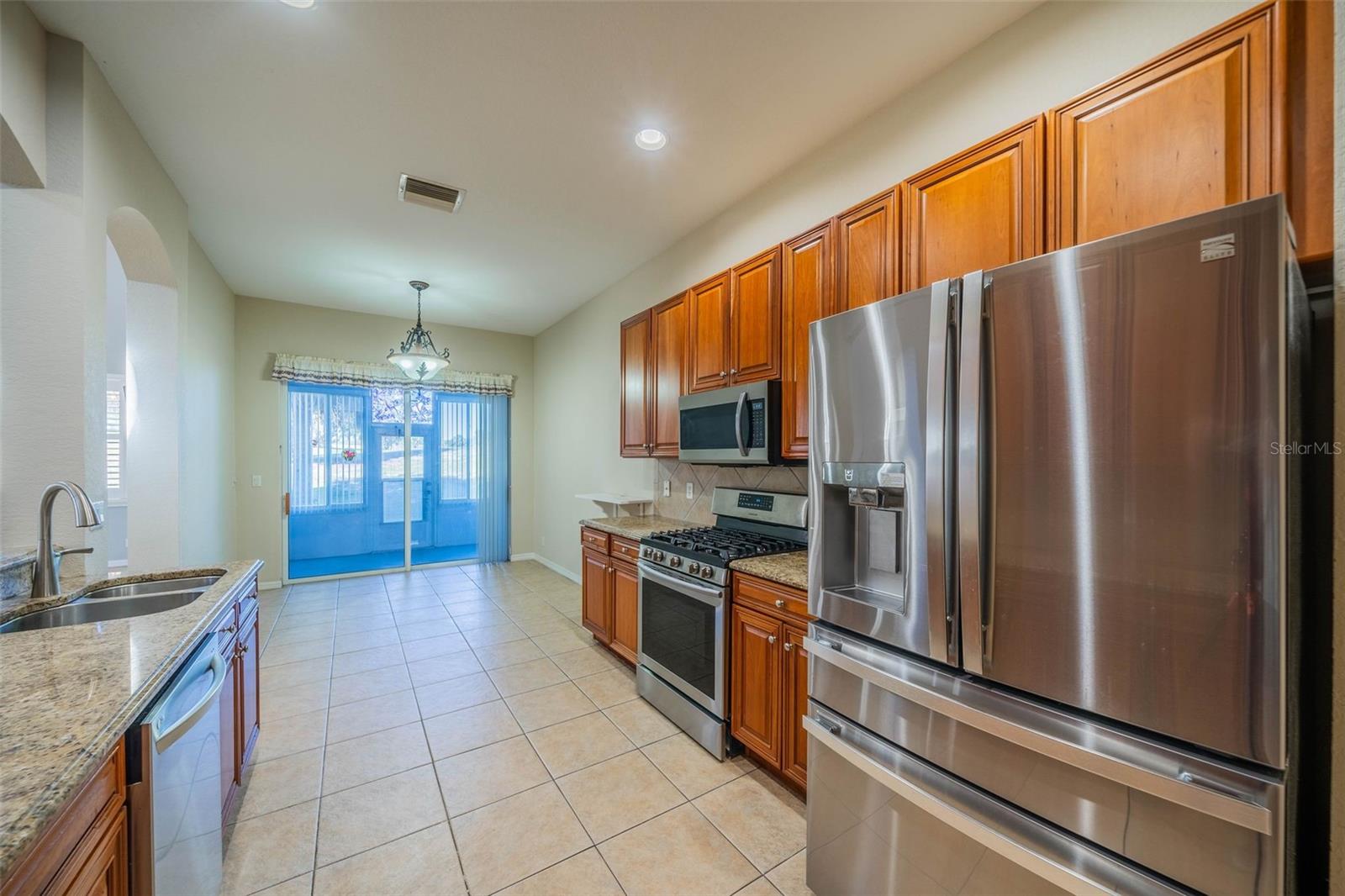 Laundry room with cabinets and sink