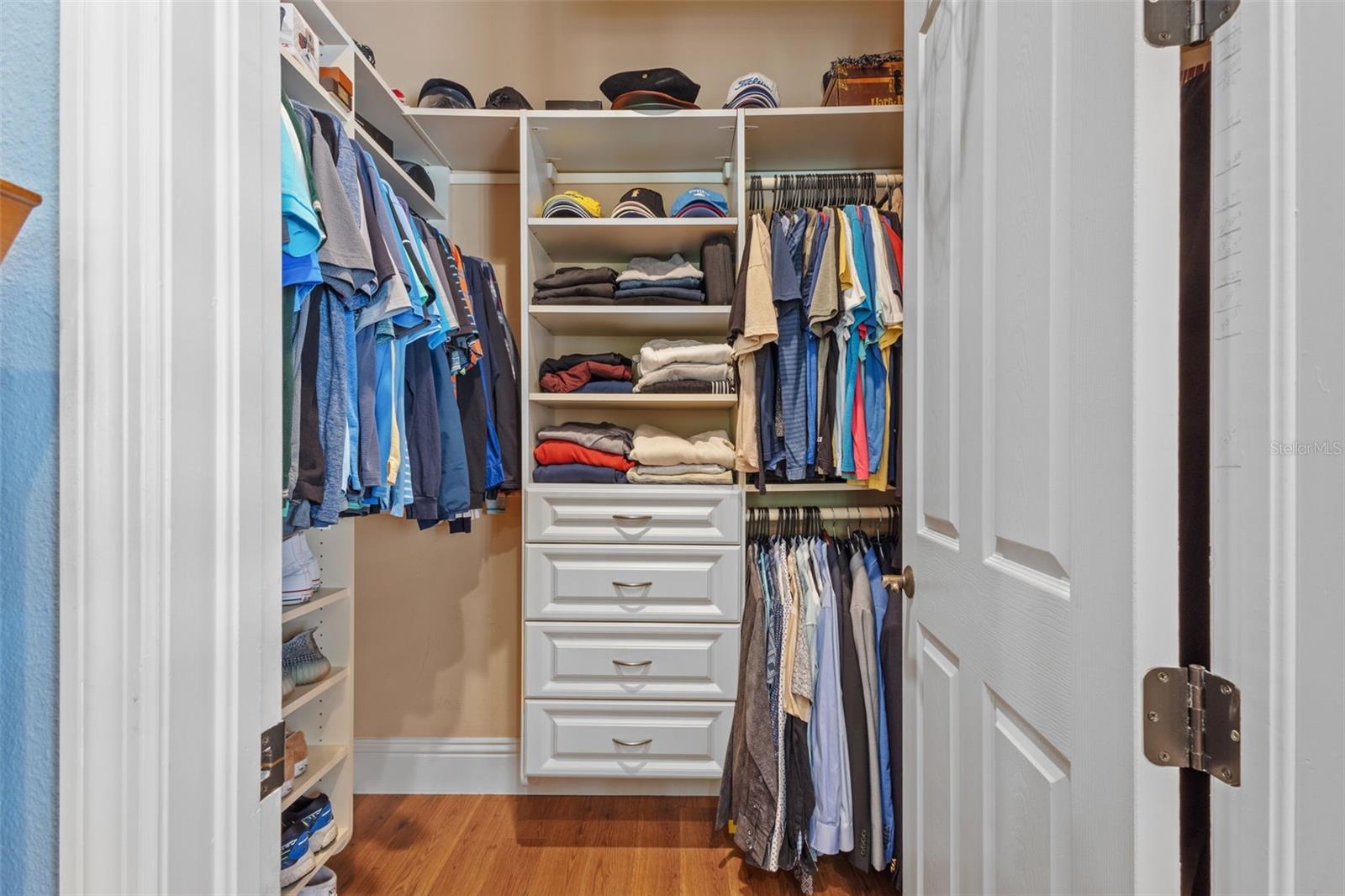 Secondary main floor suite custom closet.