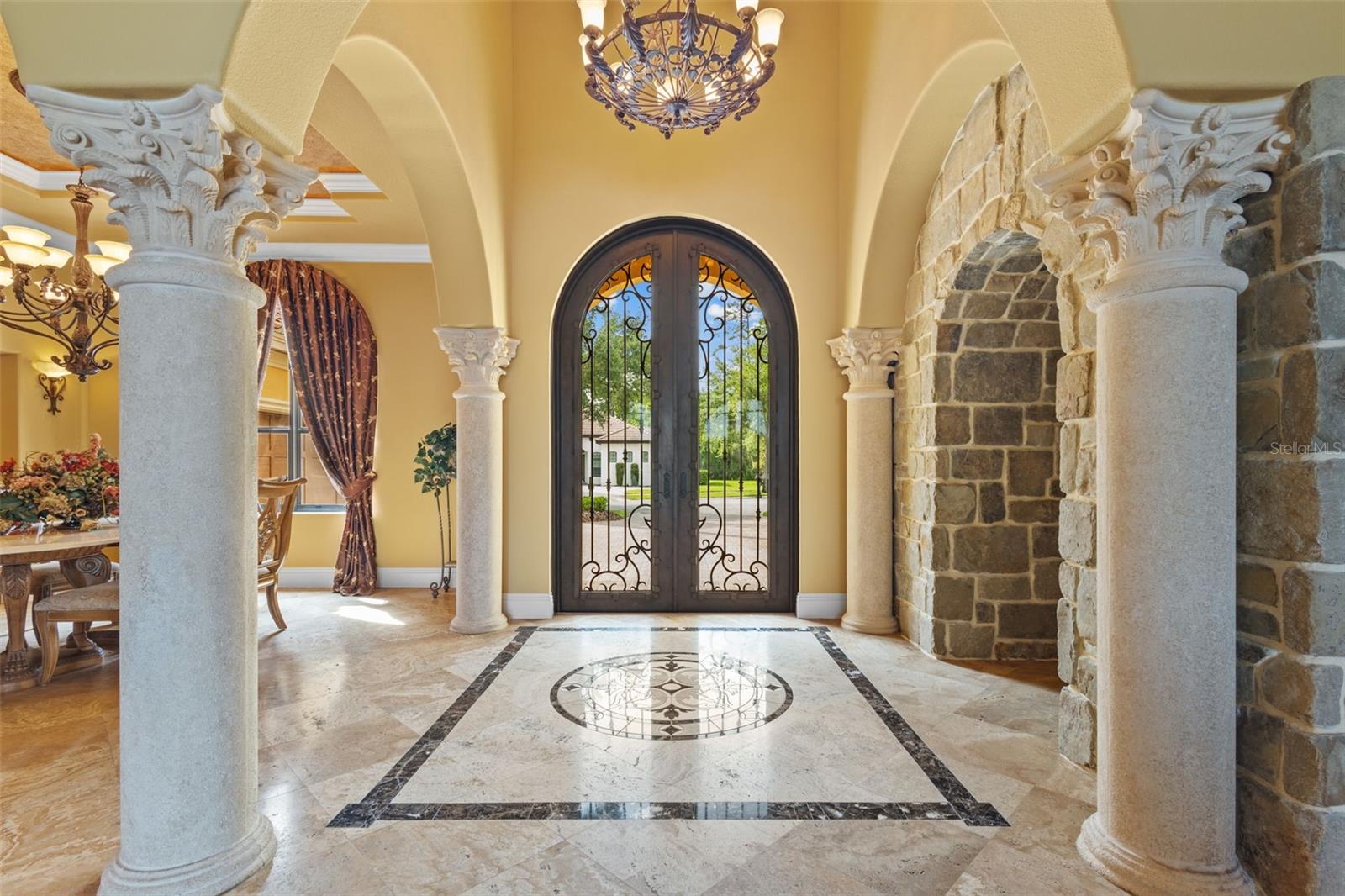 Grand foyer with hand laid marble inset.
