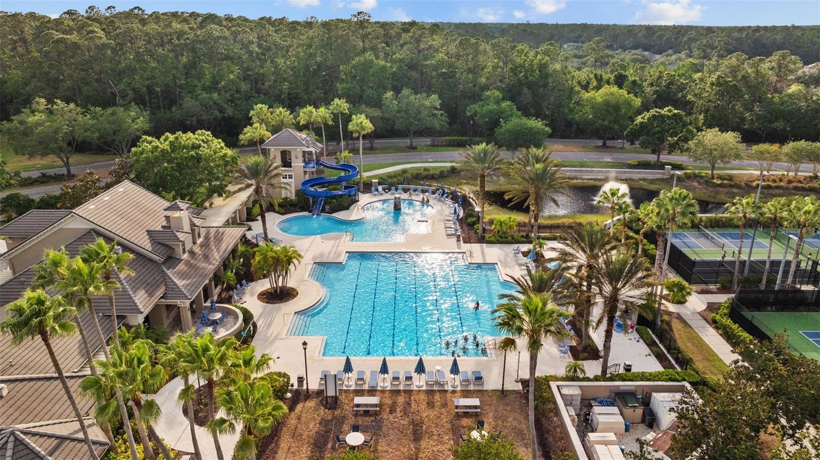 Resort style pool with lanes, kiddie pool and waterslide.