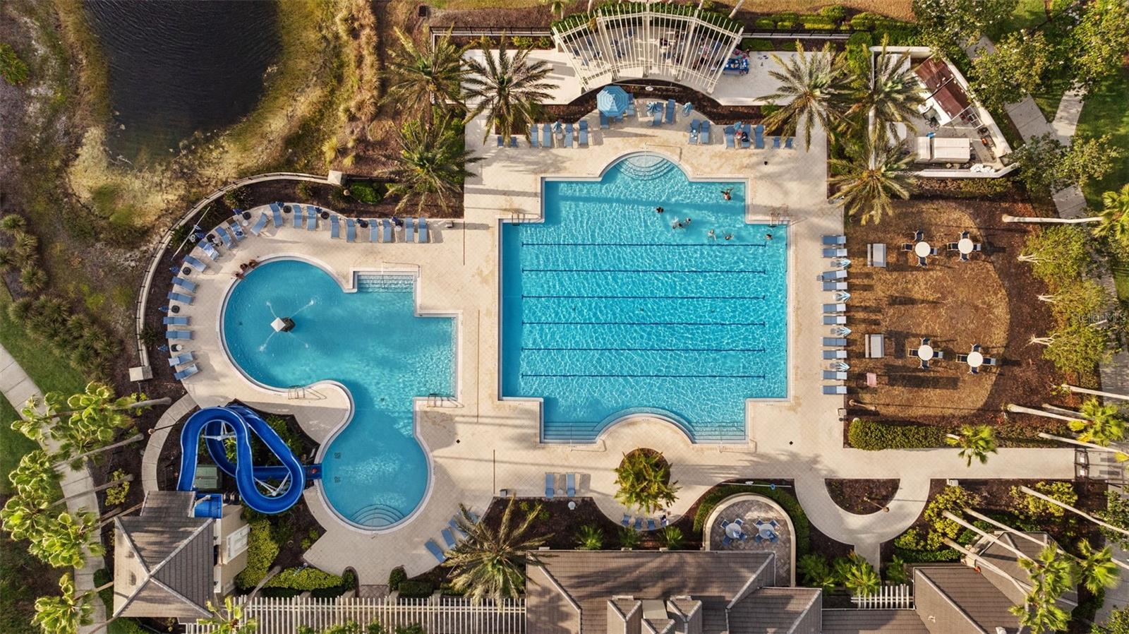 Resort style pool with lanes, kiddie pool and waterslide.