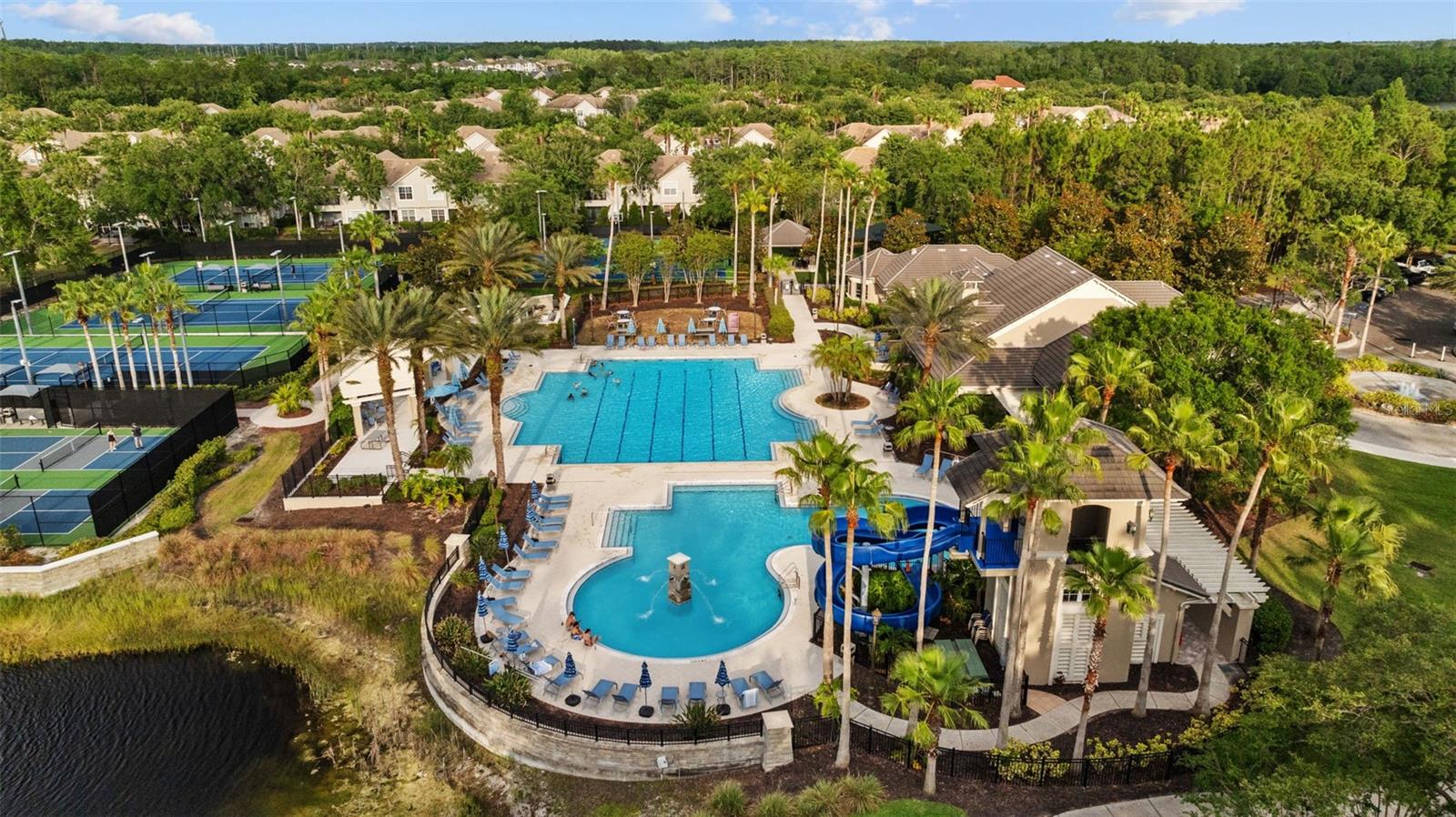 Resort style pool with lanes, kiddie pool and waterslide.
