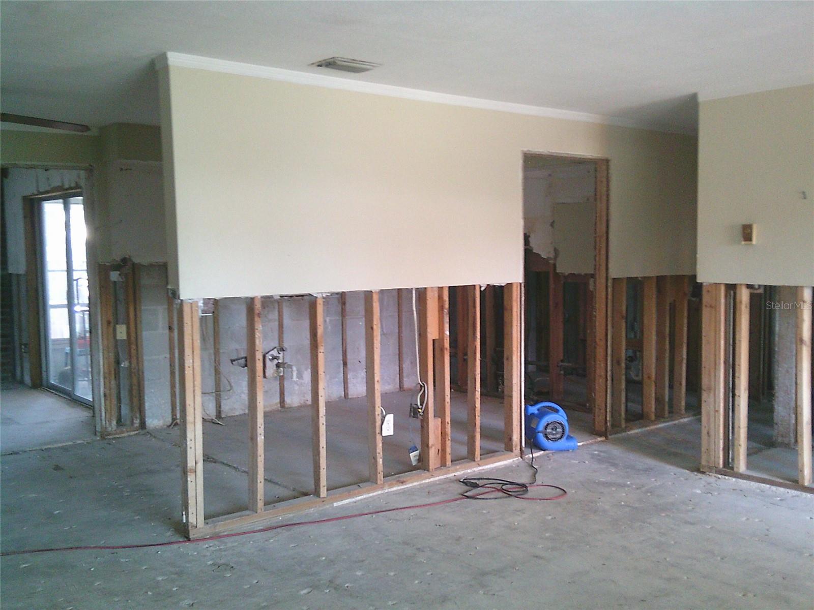Living room looking into kitchen and hallway