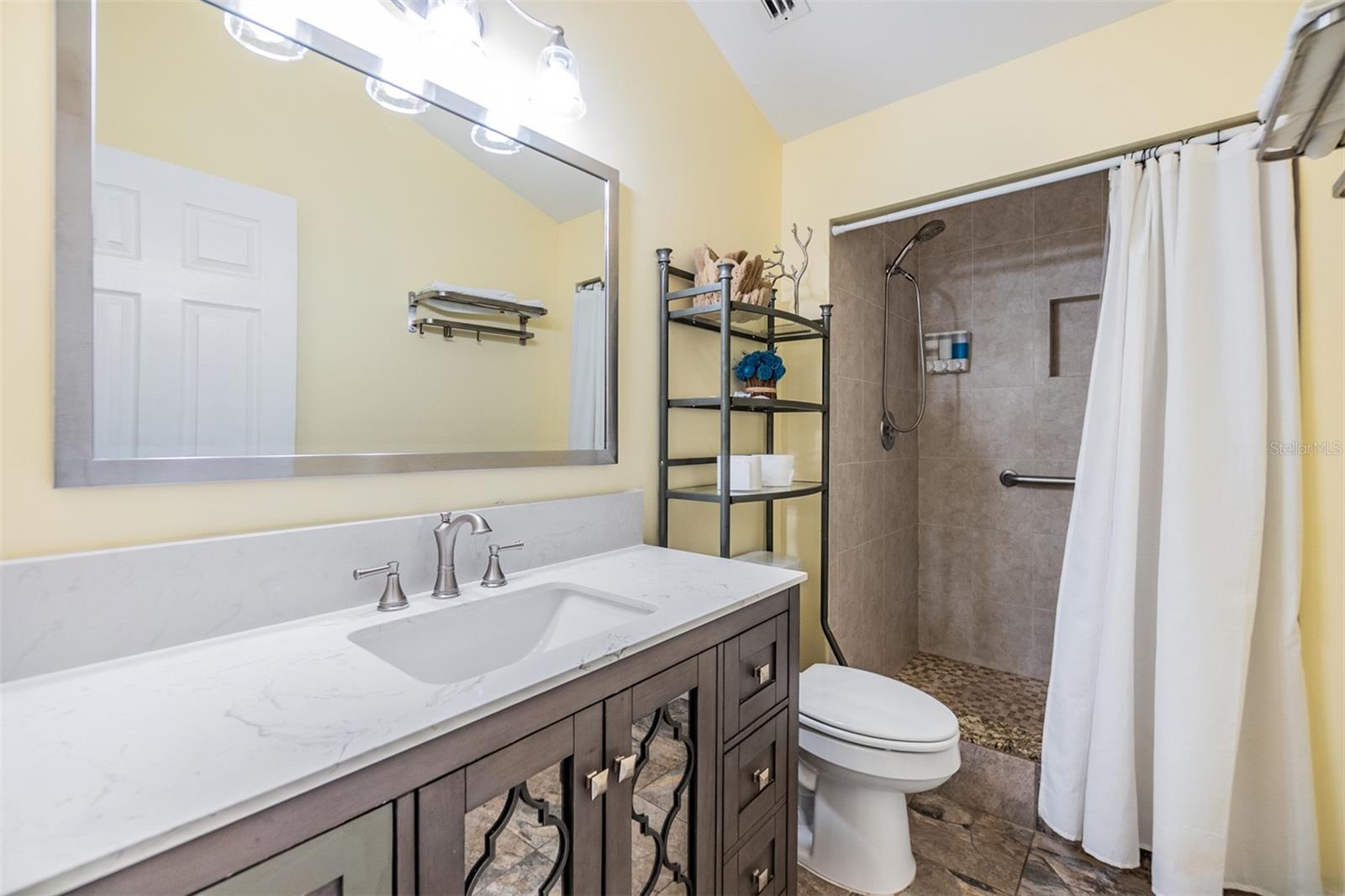 Bathroom with walk in shower, new vanity
