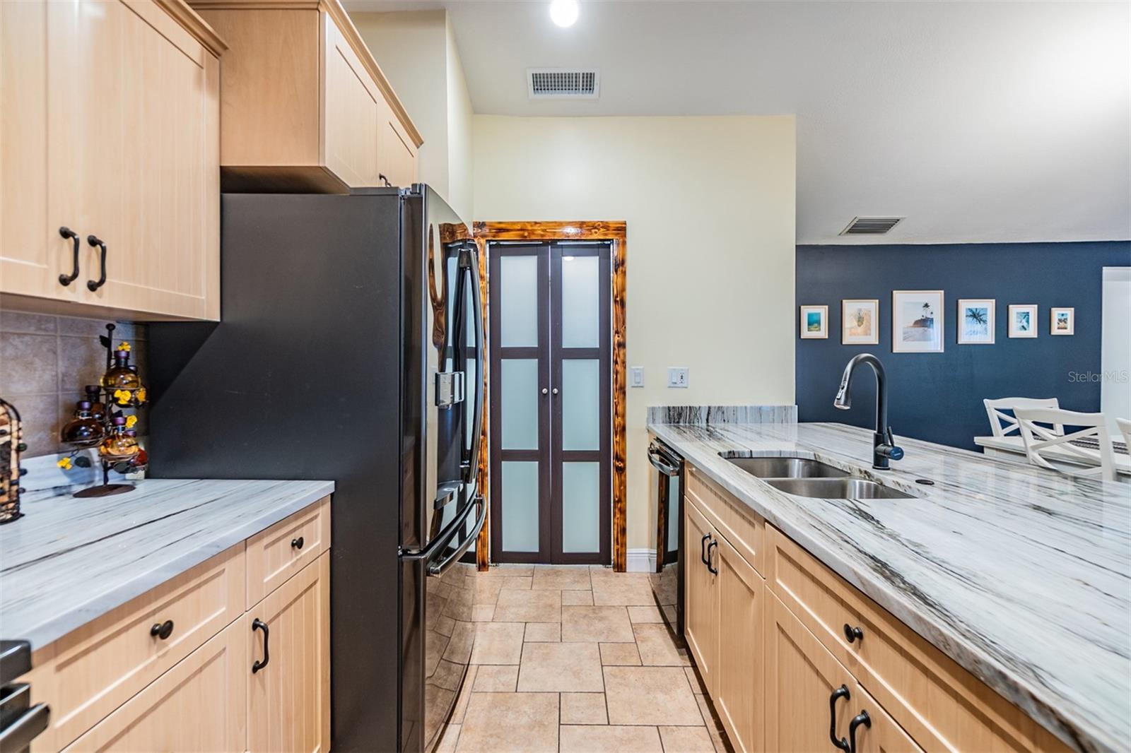 Open Kitchen, Stainless Steel Appliances, newer cabinets and Quartzite counter tops, tile flooring