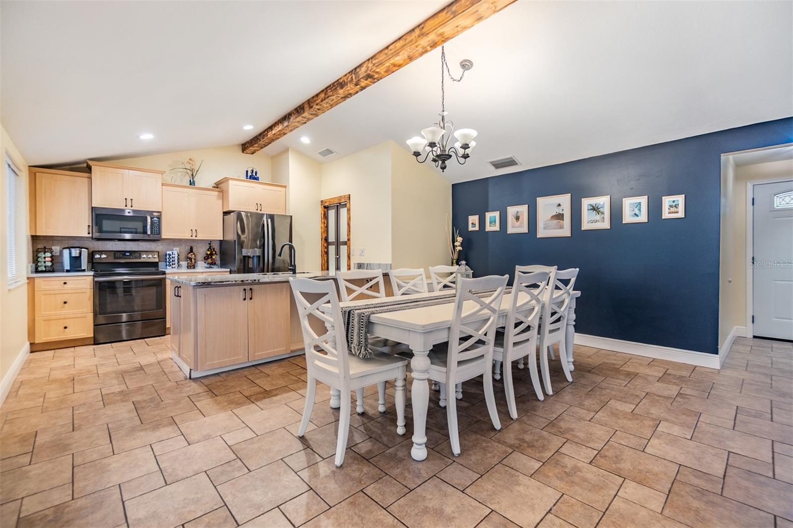 Vaulted Ceilings, Dining Room, and French doors to the outside, tile flooring.
