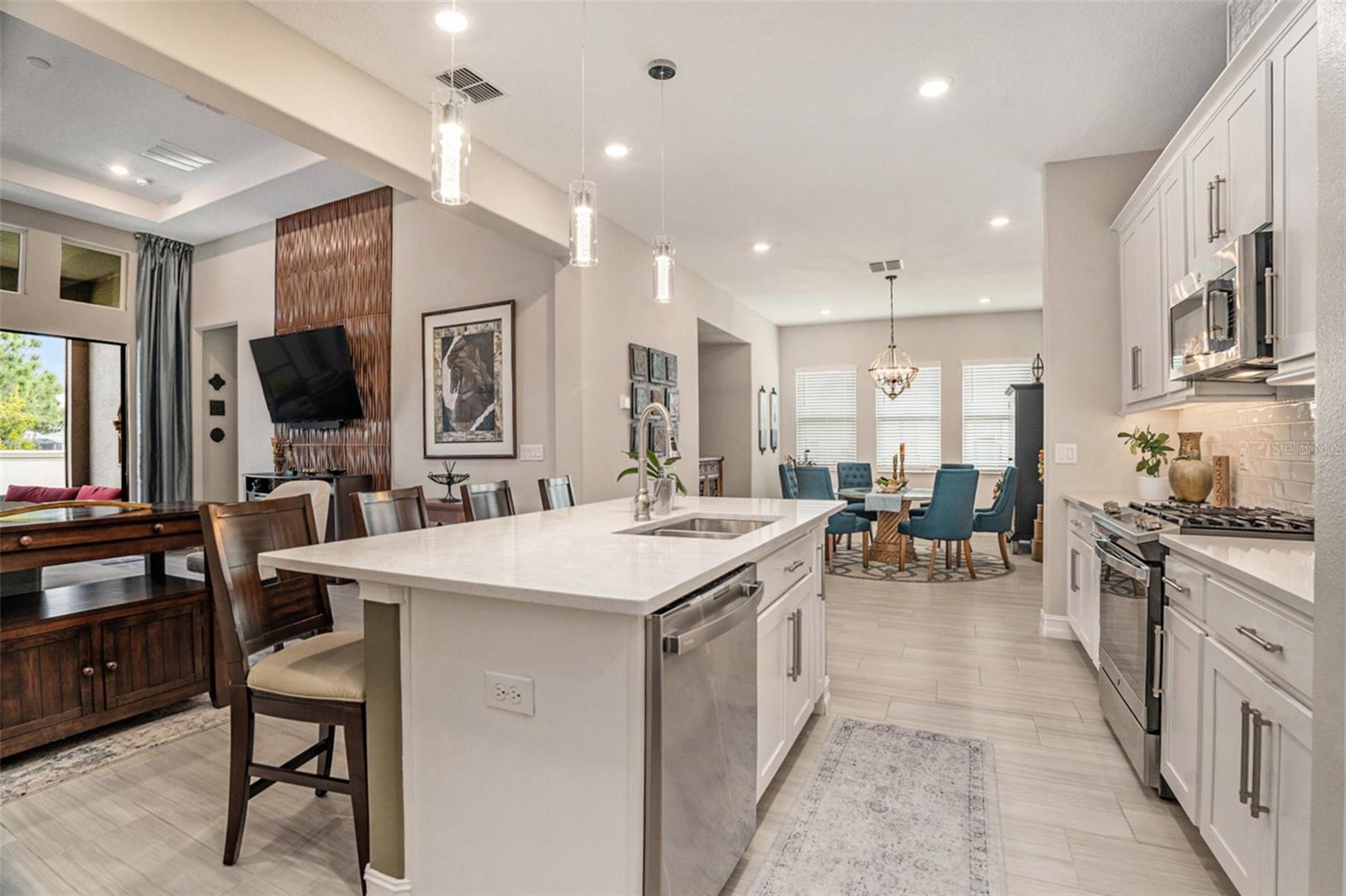 Kitchen overlooking kitchen and dining areas