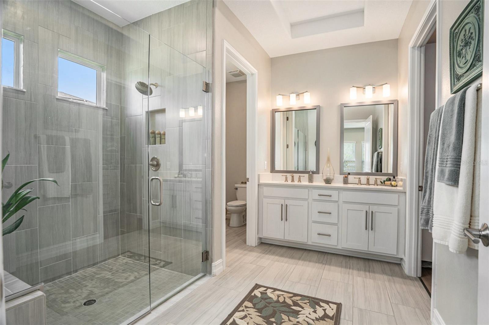 Primary bathroom with double sinks and quartz countertops
