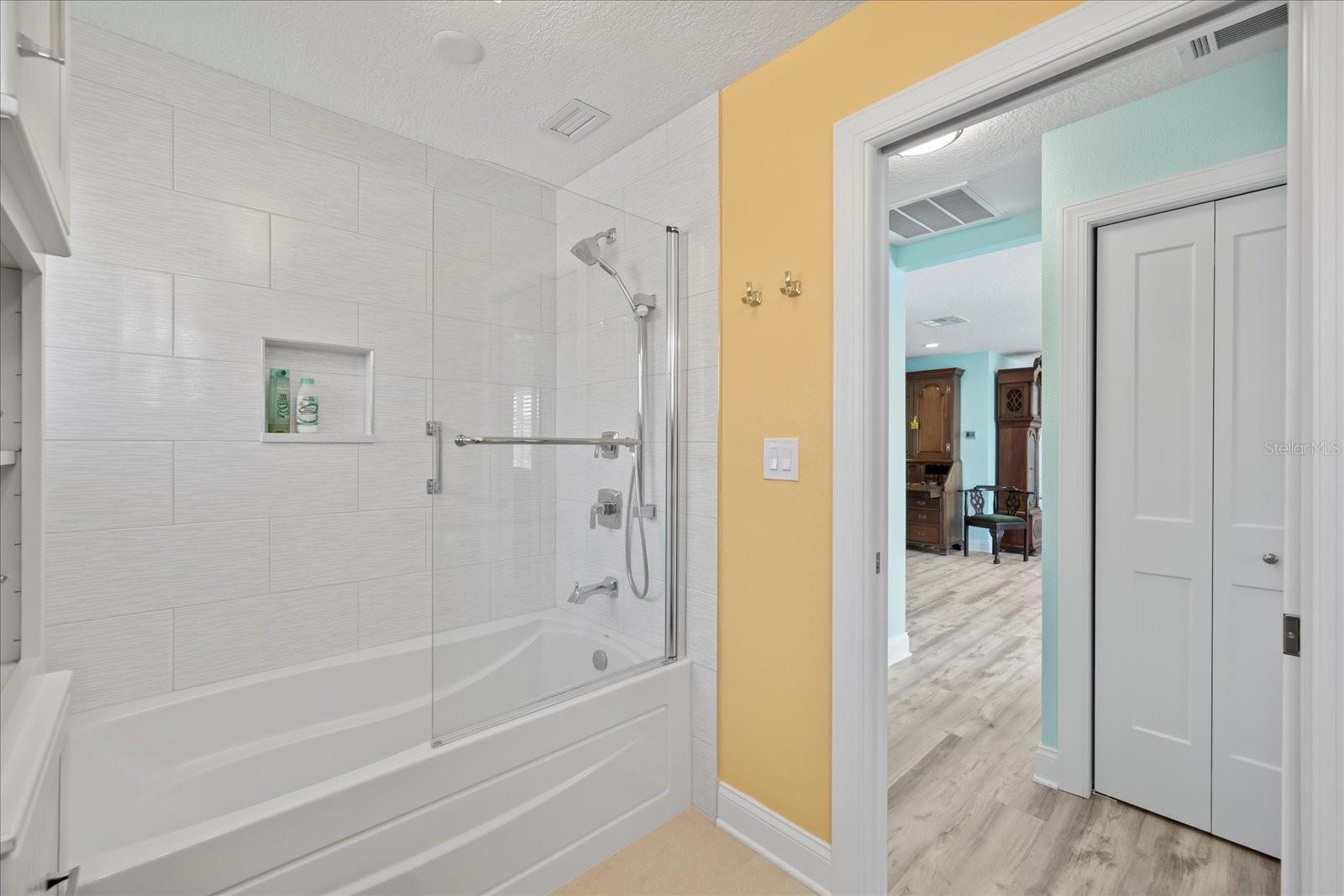 Secondary Hall Bathroom with tub and shower