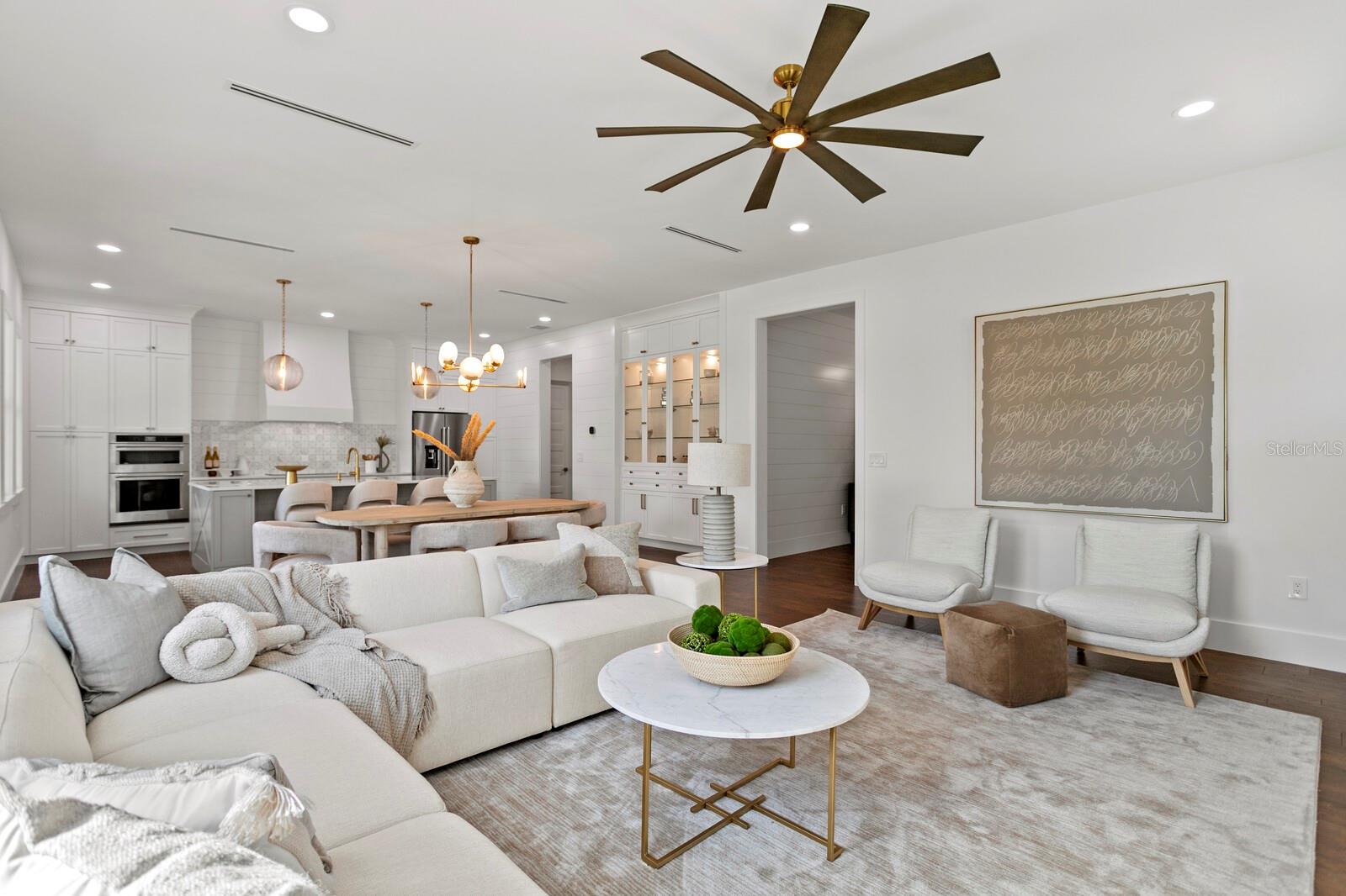 living area adjoins the dining and kitchen