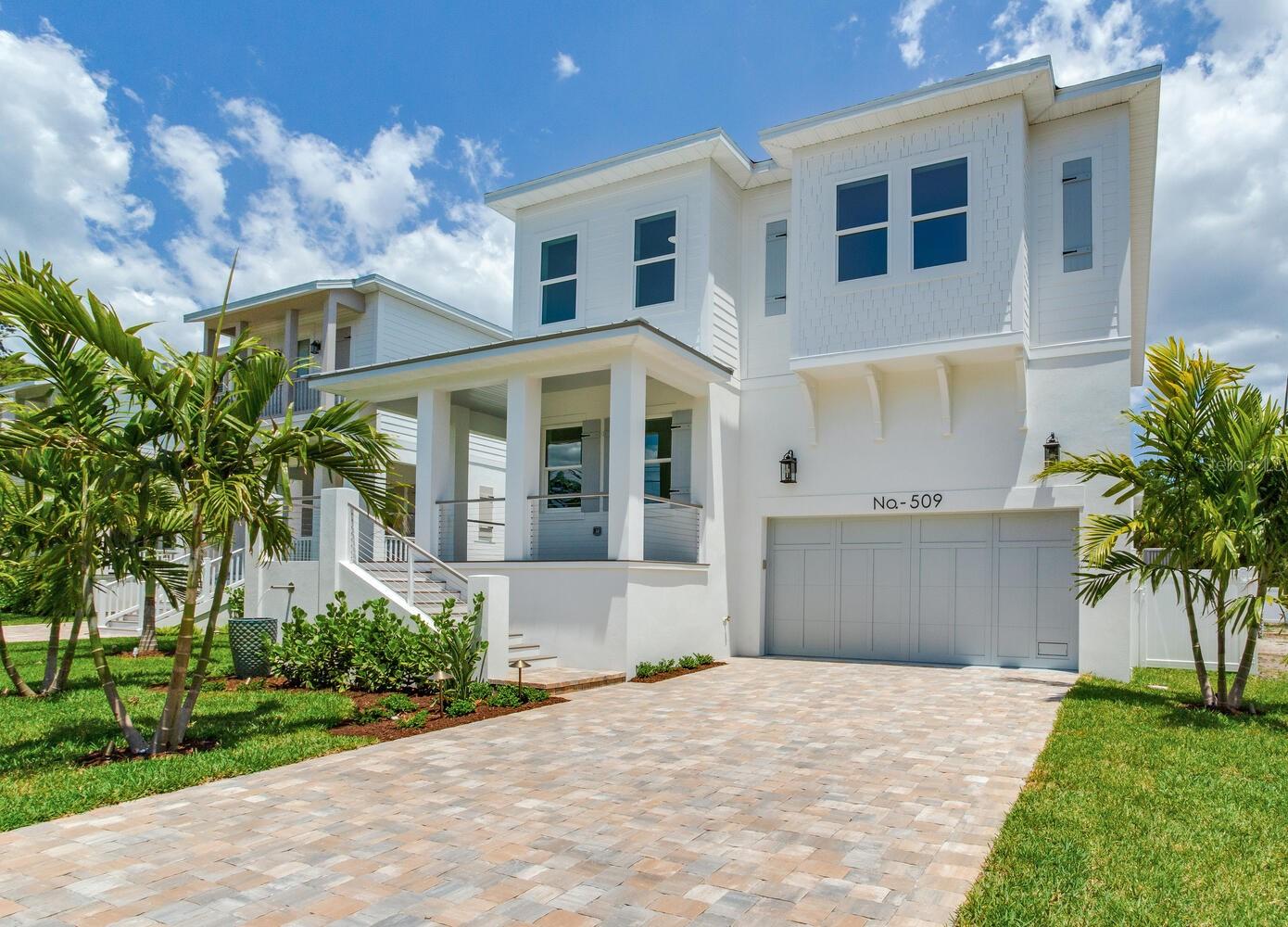Elegant exterior impeccably landscaped