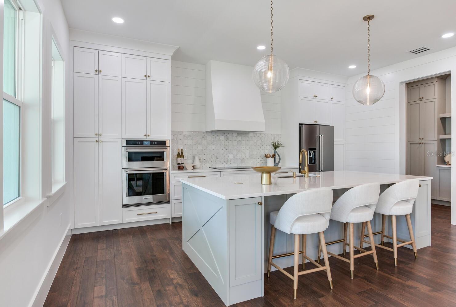 built in convection oven/microwave and ceiling height cabinetry